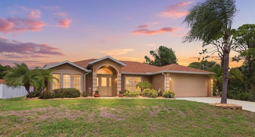 Set on a quiet street, this exceptionally maintained 3 bedroom, 2 bath home offers a rare combination of privacy, space, and thoughtful upgrades in a centrally located North Port setting. The curb appeal immediately stands out with mature palms, manicured landscaping, and defined garden beds with decorative curbing. Inside, the home opens to a bright, functional layout with tile flooring throughout the main living areas, providing both durability and easy upkeep. The split bedroom floor plan creates separation between the primary suite and guest bedrooms, offering comfort for everyday living or accommodating visitors. The kitchen is centrally positioned and designed to stay connected to the main living spaces. It features granite countertops, stainless steel appliances (just 2 years old), a breakfast bar, and abundant cabinet storage. The adjacent dining area adds a unique coastal touch with a hand-painted tropical mural that brings warmth and personality to the space. Just beyond the dining room, the enclosed Florida room offers additional living space filled with natural light an ideal for a sitting area or flex space. From there, step outside to the screened lanai and expansive brick paver patio, where the backyard becomes a standout feature. With mature landscaping, partial fencing, and no immediate neighbor on one side, this outdoor setting offers both privacy and room to enjoy. The living room features vaulted ceilings and an open feel, creating an inviting central gathering space. The primary suite is generously sized and includes a large walk-in closet (approximately 9x8), along with an en-suite bath designed for everyday comfort. Two additional bedrooms offer carpeting and ample closet space, while the home overall provides an impressive amount of storage throughout. Key updates provide added value and peace of mind, including a roof replaced in 2021, A/C in 2017, and a water heater in 2022. A brand-new Kinetico water softener system was installed in March 2026, enhancing water quality throughout the home. Hurricane shutters are included, and the property is not located in a flood zone. Conveniently located, this home offers easy access to shopping, dining, and everyday essentials. It’s approximately 20 minutes to Downtown Wellen Park and Cool Today Park, the spring training home of the Atlanta Braves, and about 30 minutes to the Gulf beaches. With its combination of condition, privacy, and recent improvements, this property presents a compelling opportunity for buyers seeking a well-cared-for home in a growing area.