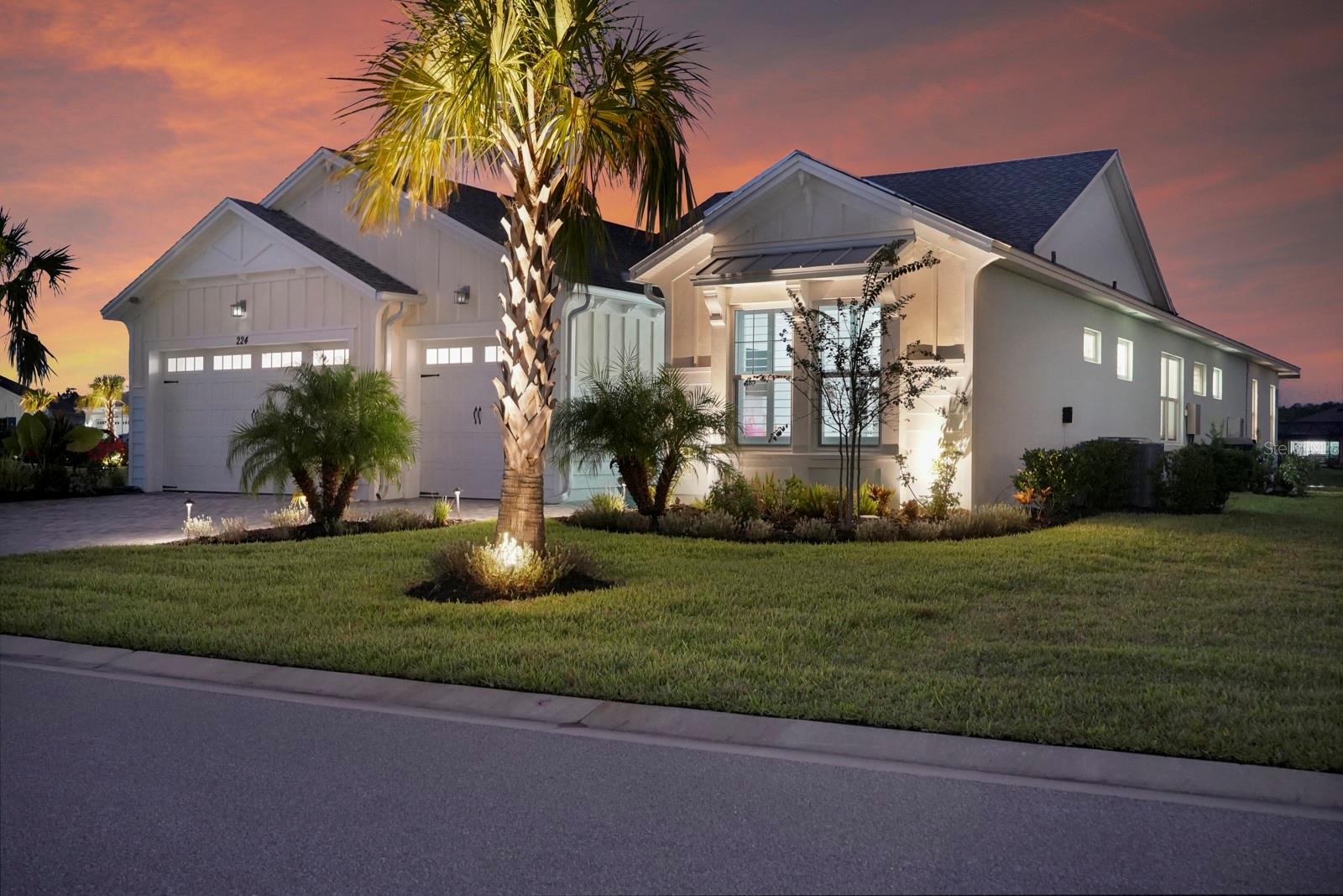 Welcome to this stunning coastal designed Trinidad model in Margaritaville Daytona Beach. Thoughtfully upgraded inside and out, this home blends beach area coastal living with luxurious finishes throughout. Perfectly positioned on an oversized lot near the cul-de-sac on a pond.
Inside, enjoy 9 ft doors, LVP floors(tile in the bathrooms) insulated block walls, white custom shutters, crown molding and recessed lighting in all rooms.
The foyer includes a coastal chandelier, crown molding and Shiplap creating a beautiful entryway.
The office/flex room has elegant glass French doors making it perfect for the remote office. Complete with a dry bar, custom cabinets and quartz countertop.
The chef’s kitchen features a massive quartz island to match the white level 5 soft close cabinets. Including crown molding, pull out shelving, under cabinet lighting and kitchen aid appliances. A double trash pullout, custom vented hood and upgrade Moen faucet complete the space.
The living room/ dining room space includes crown molding and Shiplap on the ceiling and accent wall. Top it off with a stunning Arhaus chandelier.
The primary suite is a showstopper with crown molding, accent beams, recessed lighting with reading lights, pocket doors and a gorgeous pond view. The spa like bathroom is outfitted with frameless glass, zero entry rain head shower, pebble flooring, quartz counters, Level 5 soft close cabinetry and upgraded fixtures.
The guest suites and laundry room are fully upgraded with crown molding, quartz countertops, level 5 soft close cabinets for storage and deep sinks.
The 3 car garage has insulated block walls, epoxy flooring, smart openers with cameras and plywood in the insulated attic space for storage.
Outback, the 24 x 15 ft Salt water pool and hot tub includes a heater/chiller, hot tub with waterfall, sun shelf, bubbler and LED lighting pool and hot tub. Covered lanai with entry doors on both sides of pool and Gorgeous landscaping for privacy including robellini and palm trees and flowering shrubs.
With 3 bedrooms, 3.5 plus an office/flex space this home boasts 2,564 soft of living space( 3,407 total).
Schedule your private showing today.