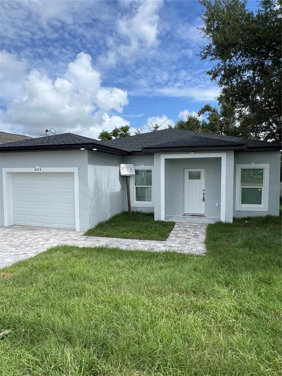 Step into this beautifully designed, newly constructed home located in the heart of downtown Haines City. Perfectly suited for first-time homebuyers, or those looking to downsize, this 3-bedroom, 2-bathroom home offers modern comfort and a fantastic open floor plan. Spacious living areas flow seamlessly, creating an inviting atmosphere for both relaxation and entertaining. Sleek, durable ceramic tile flooring throughout the home provides both style and ease of maintenance.The gourmet kitchen features high-end finishes, including stainless steel appliances, custom cabinetry, and beautiful countertops. Conveniently located inside laundry area for easy access and added functionality.This home offers a rare opportunity to live in a brand-new home, located in a desirable area with close proximity to parks, dining, shopping, and entertainment.