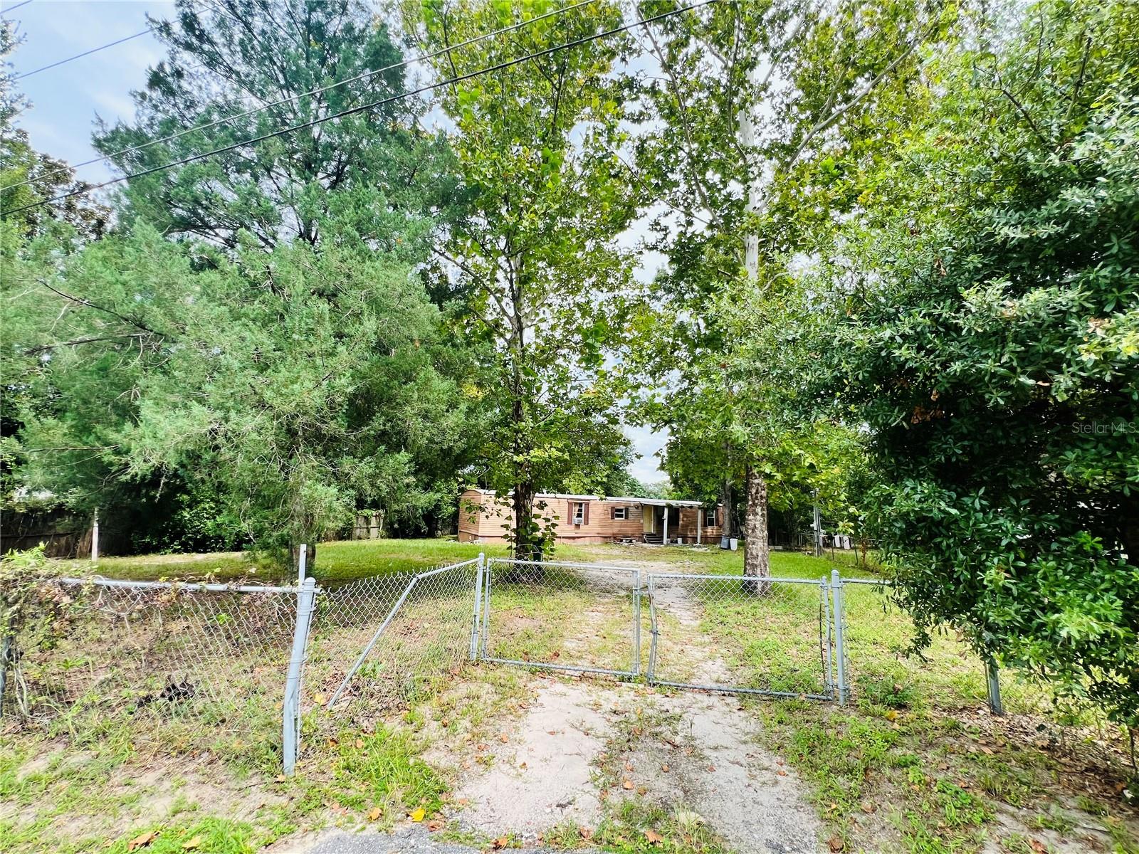 Calling all first time home owners and investors, this property is your next big opportunity! With three bedrooms and two bathrooms the foundation is already there for your family or investment. One of the best things about this home is the amount of land included with the property. Bring your own tools and creativity, because this property has limitless potential! Enjoy or advertise a good amount of land with a delightful mobile home! Come see this property today!