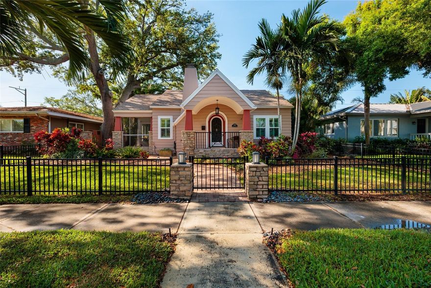 “Kissed by the charm of the 1940s, steps from Coffee Pot Bayou, and minutes to downtown’s energy—this bungalow is where history and modern living meet.” This thoughtfully renovated 1941 bungalow is located in one of St. Petersburg’s most sought-after neighborhoods, just two blocks from Coffee Pot Bayou with scenic waterfront walking paths and minutes to vibrant downtown.
From the inviting Craftsman front porch with wrought iron gate to the meandering paths and patio areas in the backyard, this home offers warmth, character, and exceptional livability. Inside, you’ll find hardwood floors, crown molding, plantation shutters, and transom windows, along with a stunning Mediterranean-style wood-burning fireplace.
The updated kitchen (2023) features white cabinetry, stainless steel appliances, farmhouse sink, natural gas cooking, and a built-in wine rack. Enjoy both a formal dining room and a sunny breakfast room overlooking the beautiful back yard. 
A light-filled sunroom addition (2015) with fractured Mediterranean tile flooring opens to a screened porch and multiple outdoor living areas, including two patios, meandering garden paths, and a fully fenced yard with outdoor lighting—perfect for relaxing or entertaining.
The primary suite offers a walk-in closet and a beautifully renovated bath with soaking tub, separate shower, and custom vanity. Additional baths have been tastefully updated.
Major improvements include: impact windows & doors (2024), HVAC (2025 with UV light & surge protection), electrical (2023), water heater (2025), roof (2009), gutters/soffits (2017), and kitchen renovation (2023). Additional features include natural gas, reclaimed water irrigation, and Sentricon termite protection.
Buyer confidence: clean 4-point inspection, wind mitigation report for insurance savings, new survey, elevation certificate, transferable flood policy ($1,629/year), and no history of water intrusion.
Enjoy an unbeatable lifestyle with easy access to waterfront walks along Coffee Pot Bayou and the dining, culture, and entertainment of downtown St. Petersburg—just a bike ride away.