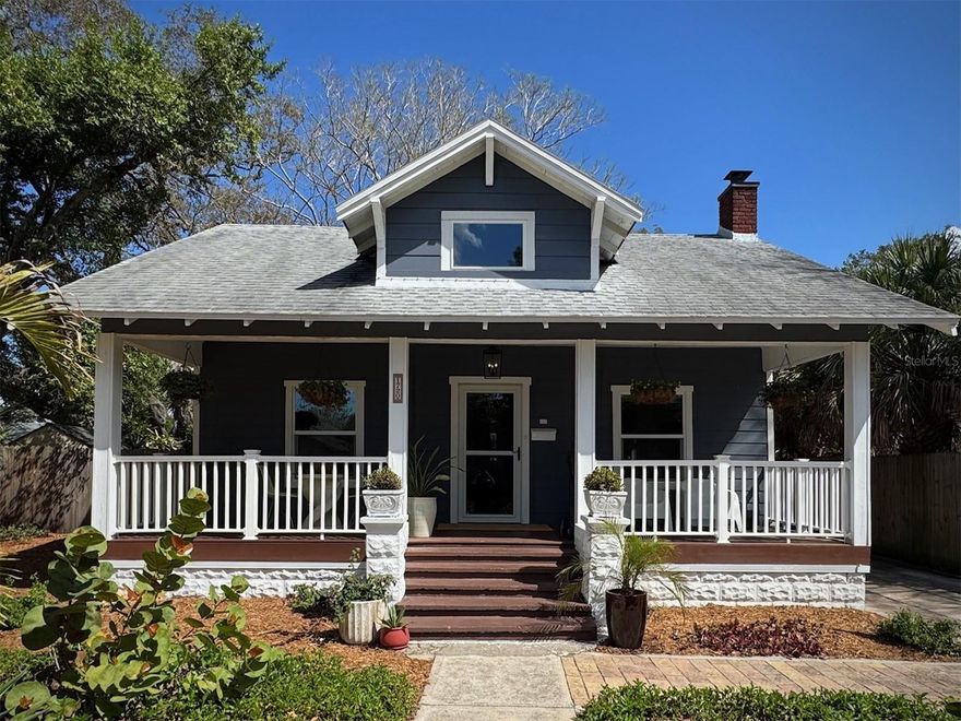 This 1925 craftsman home is tucked into a garden-like setting, moments from the Gulfport Arts District and The Gulf.  The property has been lovingly maintained, enjoying a full remodel in 2019, when a modern kitchen and baths, new windows, HVAC, roof and water heater were installed.   The hardwood floors and brick fireplace are original, as are the generous front porch and private, screened back porch. In the lush back yard, find more than a hundred varieties of plants, native birds and butterflies, shaded spots to sit, a new shed and a meandering stone path.  The gated rear driveway allows alley acess and open space for your personal use.  The large "ear tree" in the garden has a clean bill of health and was professionally trimmed in 2026.  The home carries a transferable termite warranty and was tented just this year.  Several nearby homes have been recently remodeled, and new homes are being built throughout the neighborhood.  The Skyway Trail, just one block east, gives you easy access to Clam Bayou Preserve and downtown St. Pete.  Tangerine Ave is two blocks west where you'll find wide open spaces and walking trails leading to Gulfport's Clymer Park and quirky downtown shops and restaurants.  In all, this is a unique property with undeniable charm that you'll just have to see for yourself!