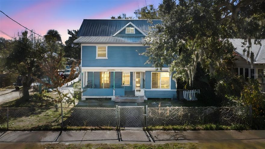 STEP INTO TIMELESS NEW SMYRNA BEACH CHARM WITH THIS 1915 DUPLEX IN ONE OF THE MOST DESIRABLE POCKETS. Just 2 blocks from the RIVER, an easy stroll to bustling Canal Street, and only minutes to the beach and Ponce Deleon Inlet.  Set behind a fenced front yard with private parking, this property offers classic character you don't find every day, including original wood floors and an inviting open front porch- perfect for morning coffee or evening breezes. with a little TLC, this is an outstanding INVESTMENT OPPORTUNITY in a high demand location where buyers and renters love to be. Downstairs (Partially gutted) unit features spacious area to be completed by prospected buyers a large full kitchen with eat in dining space, a large living room with access to porch and one large bedroom with a full bath and bonus room off the primary perfect for an Office, nursery, or flex space! Upstairs unit has a beachy chic vibe with eat in kitchen, 2 bedrooms and full bath and private patio area to enjoy the coastal lifestyle. INCOMING BOOSTING BONUS! A LARGE detached garage adds even more value and potential- perfect for storage, a workshop, or additional rental income. It also includes laundry hook-ups, offering convenience and flexibility for tenants. Whether you're looking to restore and personalize, hold as long terms rentals or add standout property to your portfolio, this is your chance to own a piece of New Smyrna history in a location that truly can't be beat!
