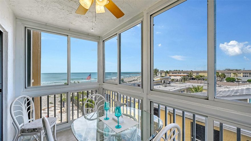 SPECTACULAR BEACH and NORTH JETTY views from this 4th floor condo in the popular SAN MARCO condominium complex on VENICE ISLAND! Watch beautiful SUNSETS setting over the gulf from your covered, screened in balcony. This 2 bedroom, 2 bathroom condo with open concept kitchen and living area is the perfect full time or seasonal vacation getaway. AND could also be a great rental investment opportunity with 1 month minimum rentals possible here with Association approval. Beautiful tile flooring in all rooms. DIRECT BEACH VIEWS  from the primary bedroom! The primary bedroom also has convenient built in drawers along one wall, giving you plenty of storage space. Nice sized walk in closet in the second bedroom. This condo is in a perfect location within easy walking distance to a gourmet waterfront restaurant and Venice Yacht Club. Venice Island Main Street is just a few blocks away with many more delicious restaurants, boutique shoppes, farmers market once a week, fun festivals to enjoy and much more.  NEW HURRICANE IMPACT windows throughout this unit (not in the balcony area) with additional tinting to protect sea life from interior lighting. NEW A/C in 2025, water heater new in 2023. SOLD TURNKEY, all furniture and items included. NEW ROOF on the condo building in 2024.  The Clubhouse room was just beautifully renovated and leads to the heated BEACHFRONT community pool with plenty of areas to relax in and a place to grill your favorite food. This unit comes with a coveted, covered parking spot deeded for 1 vehicle under the building, at street level. Secure entry to elevators inside for added piece of mind. This unit also has a storage closet near the laundry room on the same floor as the unit, a great spot to store all your beach gear. This is a wonderful opportunity to live on beautiful VENICE BEACH!