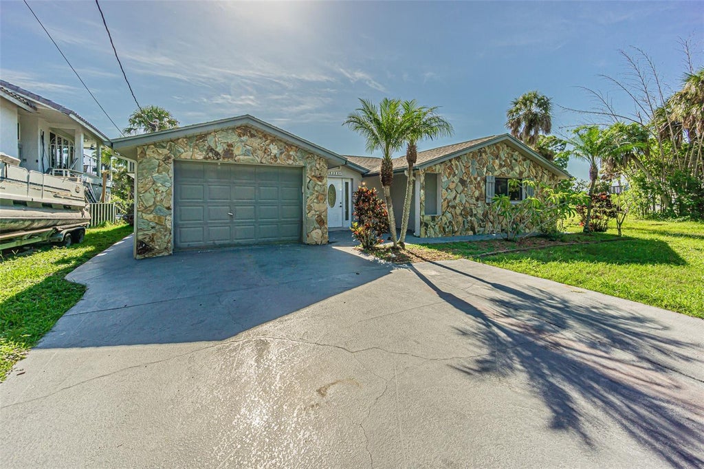 Photo of 5254 Miller Bayou Drive, Port Richey, FL 34668 (MLS # TB8530139)