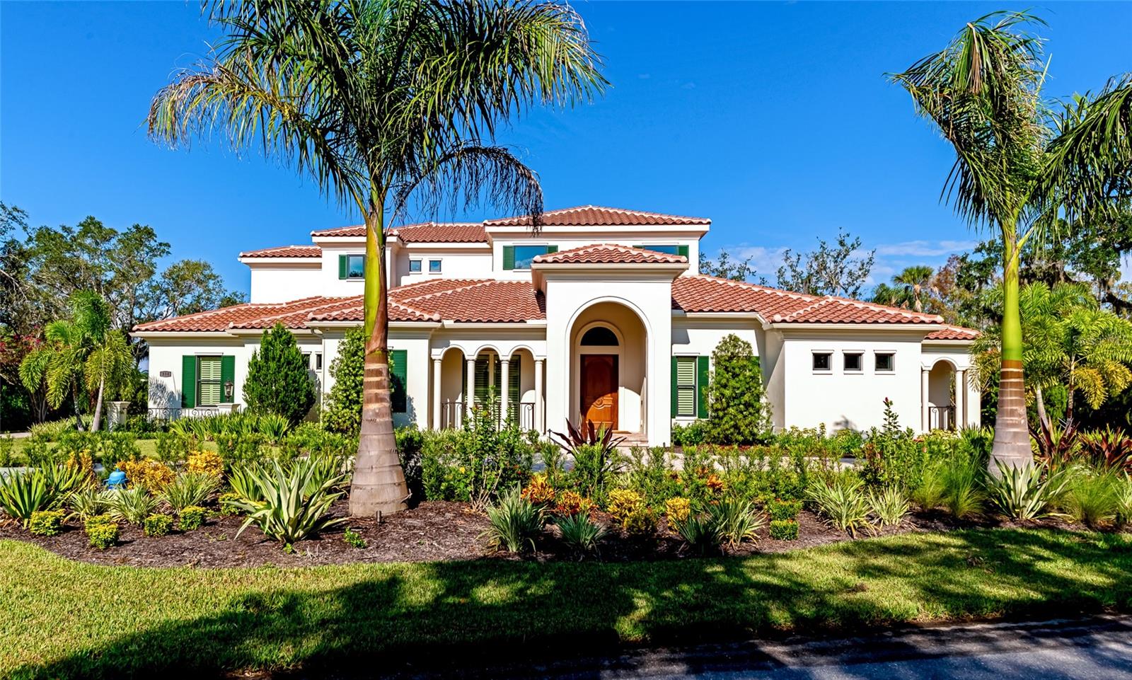 How to describe a masterpiece?! This home was completed in February 2023, and is ready for a new owner to enjoy the breathtaking features it offers. This home is still under the builders warranty! It’s like getting a new home without the two year wait for a custom built home! This gem is truly a one of a kind in The Oaks Country Club Community. The Oaks is considered to be the pinnacle in country club living and best of all THE SELLERS ARE OFFERING TO PAY THE $100,000 CAPITAL CONTRIBUTION ON BEHALF OF THE BUYER! (With acceptable contract.) The owners have painstakingly thought out each detail from purchasing the lot, drawing up plans with an architect to having the home custom built by Henson Contractors, to making sure every item was of the finest quality. The home is situated on one and a half lots, making for a grand appearance with a circular paver drive and a side paver drive leading to the oversized 3 car garage with epoxy floors and built-in cabinetry. The interior exudes quality from the minute you arrive at the custom 4 foot wide solid mahogany front door. Entering the home you will come upon the great room with expansive 24’ ceiling height and a chandelier that is one of the focal points. Other features of the greatroom include built-in bookcases, fireplace and coffered ceiling. Open to the great room is a wet bar enclave just perfect for entertaining. Another breakfast bar area opens to the kitchen. Ah, the kitchen! Every detail is of highest quality including a Miele steam/convection built-in oven, two kitchen sinks (a third sink in the bar enclave), propane gas Wolfe range, custom cabinetry, Sub-zero 42” wide refrigerator, a pantry with sliding ladder and more! The master suite is a dream come true! Two walk in closets that should satisfy those looking for the ultimate in closets. A triple mirrored dressing area in also a unique feature. The master bath is exceptional with large double headed shower and plenty of cabinet and counter space. Currently used as an office, the fourth en-suite bedroom has rich wainscoting, and a private bath. The den is currently used as a piano room and offers floor to ceiling book cases. Upstairs is the loft large loft, another bedroom and bath. Doors lead to the second floor balcony with retractable awning. Other features include an AV closet, a drop zone room for a future elevator. The outdoor living space is outstanding! Large covered lanai with two seating areas, in-wall gas fireplace, plus 3 remote controlled hurricane shutters, travertine flooring, 18x32’ salt water, heated pool with sun shelf and spa. Expansive clear view screening, outdoor shower, outdoor kitchen. Other features are impact windows throughout, “Lutron” programmable light switches, 3 air handlers, dream laundry room, powder room with Murano vessel sink, two tankless recirculating hot water heaters, Generac 38 kw whole-house standby generator, whole house water filter, “control4” home automation (security, lighting and comfort/temperature)and extensive landscaping gives a well established look. Reading a list of features is nothing compared to coming to see this showplace! If you are in the market for a classic and timeless new home, you will not find anything finer on the market! HOA fees do not include mandatory Country Club Fees. Check pricing schedule for details. Come take a look at The Oaks Country Club and if your are not familiar with The Oaks it is a historic landmark community - where luxury lives!