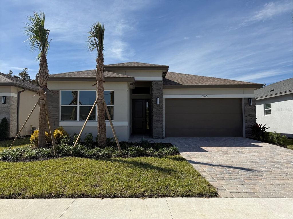 Photo of 3166 Malta Avenue, Wesley Chapel, FL 33543 (MLS # J994827)