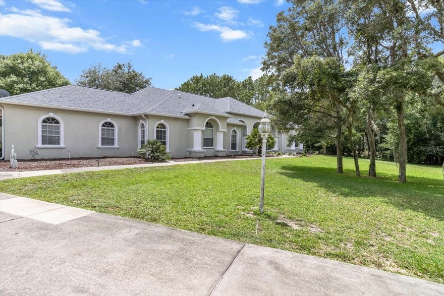 Short Sale. Welcome to your private Florida retreat! This beautiful home located in Pine Ridge Estates is perfectly designed for entertaining and relaxing. The gorgeous well-appointed gourmet kitchen includes stone countertops, center island, walk-in pantry, built-in microwave, double ovens & duel-energy gas range. The expansive owners suite offers oversized closets, resort bathroom with jetted tub, walk through shower with dual rain shower heads, seating and separate vanities. The deep driveway wraps around to the oversized 4 Car garage. The1.06 acre property with fenced yard offers privacy while still in neighborhood setting. This home features a NEWER ROOF (NOV 2022), hot water heater (2022), deep well for irrigation (2022), RECENTLY SERVICED full house Generac, 2 AC Units (2025 & refurbished 2024). The 3 panel glass pocket doors open to the expansive Lanai with sparkling heated pool & spa. Pool pump (2022) Gas heater (2024)Pool Sweep (2024).