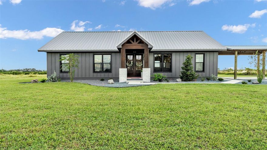 BEAUTIFUL HOME ON ALMOST 5 ACRES! This custom-built home was built last year by Williams Construction. No expenses spared. Hardi board exterior, upgraded black windows, metal roof, stone countertops, fireplace, high ceilings, stainless steel appliances, large walk-in closet and walk-in showers. Polished concrete flooring throughout. Offering low maintenance and long-lasting durability. The large window in the kitchen not only looks out over the property but also open up so you can serve guests. Enjoy the large back porch, made for sunset sittin and sweet tea sippin! Call today for a private showing!