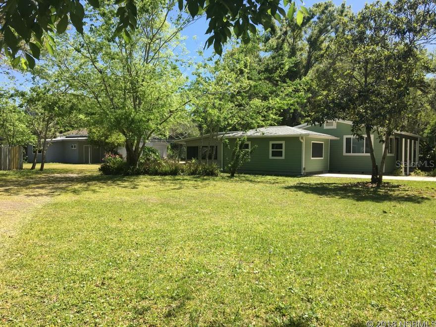 Major Renovation of this 3BR/2BA Home made it 'As Cute as a Button' and Move In Ready! If you desire a nice home on a 148' x 203' parcel, with huge outbuildings, close to town - THIS IS THE ONE! New since 2014: Remodeled from the frame out to include Hardi-board Exterior Siding, Fresh Exterior Paint, Sheetrock, Doors, Vinyl Framed/Insulated Windows, Central HVAC System with Heat Pump, HWH, Septic System, Kitchen and Baths with Granite Tops, Most of Plumbing and Electrical Systems. Roof (2016). Real Hardwood Oak Floors refinished and Fresh Interior & Screen Porch Paint (2018). Large interior Laundry Room with sink/tub. Step out the french doors from the home's sunken Livingroom onto the oversized 650 SF Screened Porch with adjoining 14'x 20' Recreation Room w/Window A/C- The perfect entertaining space! A 1378 SF Out-Building/Workshop has an Office Area w/Wall A/C, a 1-car garage/storage space, 11'x23' loft area with 4' exhaust fan, and a 30' x 17' cement parking pad with steel frame for cover. There is also a separate 416 SF Out-Building for additional storage. Last but not least - a special Child's Play House with fern covered roof! Lush Landscaping includes tangerine tree, loquat fruit tree, ginger plants, majestic oaks and fern. Rural Living literally minutes from town and schools with easy access to the Beach and Hwy 44, US-1 and I-95 for easy commutes. A 'Must See' to understand all the potential this versatile property offers! MLS information is intended to be accurate, however, it is suggested the you verify all information. Owner is a licensed real estate agent. ;Water: City