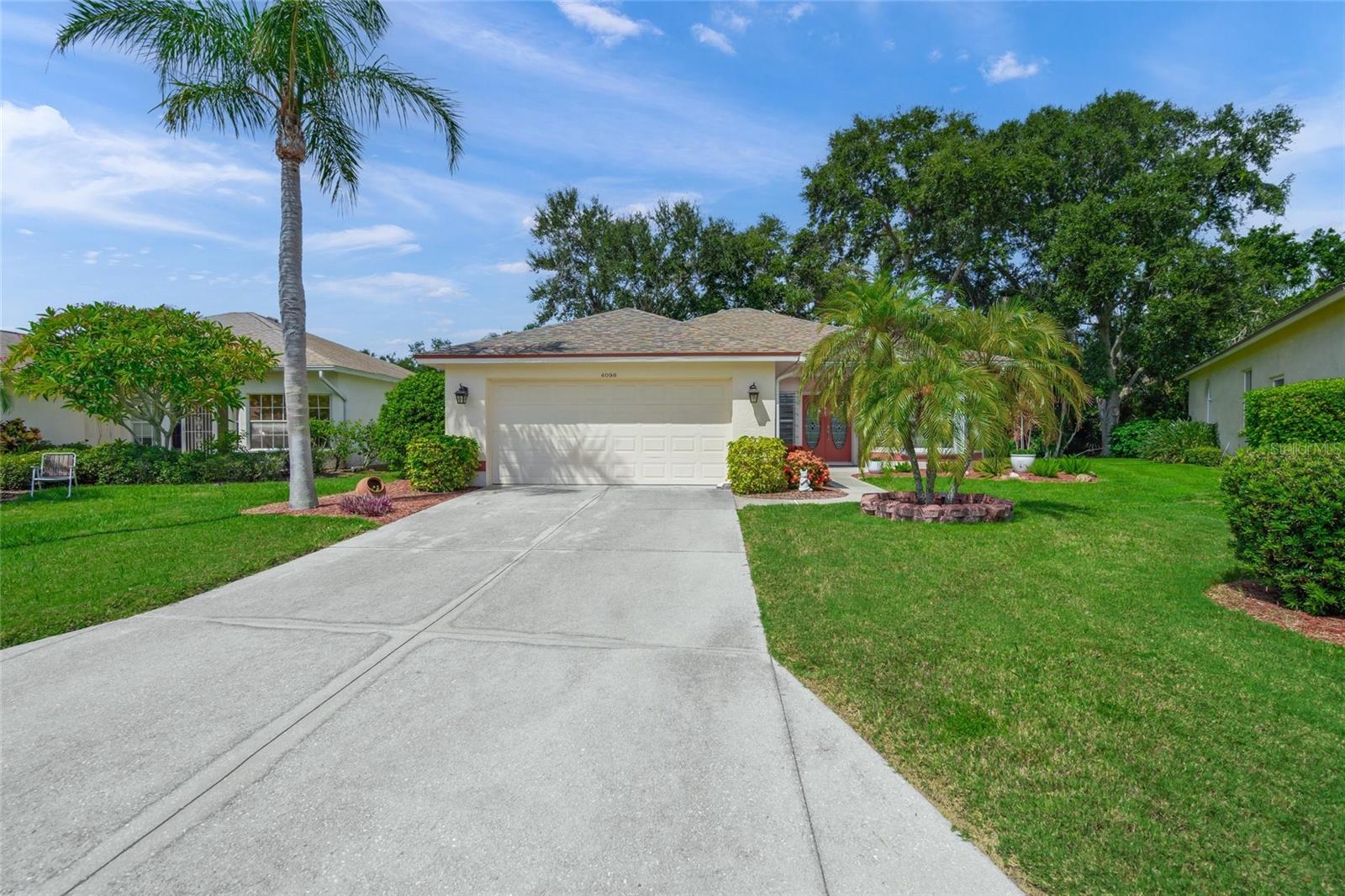 Welcome to this beautifully updated 3BR,2BA home with a 2-car garage, nestled beneath a canopy of shady trees and lush greenery, within the gated, non-golf section of the highly desirable Stoneybrook at Palmer Ranch. From the moment you arrive, the curb appeal and tranquil setting set the tone for the warmth and care found throughout the home. Pride of ownership shines through every detail, with thoughtful updates that make this residence as functional as it is inviting. Step inside to discover rich engineered hardwood floors that flow seamlessly through every room, creating a warm, cohesive ambiance. The open and airy layout features spacious living and dining areas that are flooded with natural light, offering the ideal setting for everyday relaxation or hosting friends and family. The heart of the home is the beautifully renovated kitchen, outfitted with custom cabinetry, pull-out drawers in the pantry, a convenient lazy Susan, and sleek granite countertops. Modern appliances, including a 2021 LG refrigerator and a 2023 LG stove with a built-in air fryer, elevate the space with both style and functionality. The adjoining kitchen nook offers additional space and versatility. The private primary suite serves as a peaceful retreat, complete with a secluded entrance to the lanai, a generous walk-in closet and a fully remodeled en-suite bathroom. Here, you’ll find soft-close custom cabinetry, granite countertops, built-in storage, and a walk-in shower. On the opposite side of the home, two well-appointed rooms share an updated guest bathroom that features a new vanity, contemporary lighting, a stylish mirror, and updated plumbing fixtures, providing both comfort and sophistication for guests. Beyond aesthetics, this home has been upgraded for long-term peace of mind. It features durable PEX plumbing paired with a whole-home water filtration system, a newer HVAC system (2018), a newer shingle roof (2019), and hurricane shutters added in 2020 to offer extra protection during storm season. Step out back to your private screened-in lanai, where you’ll be greeted with tranquil views of the lush backyard, shimmering pond, and beautifully maintained tropical landscaping. Whether you're sipping your morning coffee or enjoying a peaceful evening, this outdoor space provides the perfect backdrop for year-round Florida living. Set within a quiet and secure gated neighborhood, residents of Stoneybrook enjoy access to a sparkling community pool and well-kept surroundings. This central Sarasota location offers unbeatable convenience—just minutes from Siesta Key's world-famous beaches, Legacy Trail, shopping, dining, and top-rated schools. Brimming with comfort, upgrades, and undeniable charm, this move-in-ready home presents a rare opportunity to enjoy the best of Florida living in one of the area's most sought-after communities