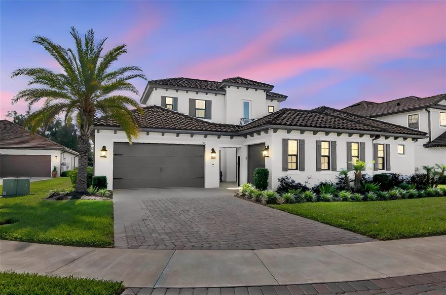 Luxury-Exclusivity-Privacy. A fully upgraded 4,101 square foot luxury home on a private cul-de-sac in the gated River’s Edge community, offering 4 bedrooms, 5 full bathrooms, a 3-car split garage, and a rare 0.34-acre lot with no front or rear neighbors and unobstructed water and preserve views. Built by Taylor Morrison as a custom owner-designed Humbolt floor plan, this home combines a true multi-generational layout with high-end finishes, expansive living spaces, and seamless indoor-outdoor design in one of Wesley Chapel’s most desirable luxury communities. From the moment you arrive, the courtyard-style entry, paver driveway, tile roof, and gated front courtyard create an immediate sense of privacy and presence. Inside, wide-open sightlines draw your attention straight through to the backyard, water, and preserve views. The interior features 11-foot ceilings, 8-foot doors, engineered hardwood flooring throughout the main living areas, tray ceilings with crown molding, oversized windows, and abundant natural light. The living room is designed for both everyday comfort and entertaining, featuring recessed lighting and triple pocket sliding glass doors that fully open to the lanai for true indoor-outdoor living. 
The kitchen rivals custom homes with an oversized island with power on both sides, contrasting cabinetry, beveled quartz countertops, under-cabinet lighting, Monogram double ovens, gas cooktop, dishwasher, microwave, LG refrigerator, custom vent hood with infrared warming light, extensive cabinetry, and seamless flow into the dining room, dry bar, and butler’s pantry. The adjacent eat-in area is surrounded by windows with uninterrupted backyard and preserve views. The privately positioned primary suite offers tray ceilings, lanai access, and a spa-style bathroom with split vanities, makeup station, oversized walk-in shower with floor-to-ceiling tile and frameless glass, private water closet, and a custom extended walk-in closet with built-ins and full-height storage. Additional bedrooms are thoughtfully positioned in a three-way split layout, including a private guest suite with en-suite bath and two secondary bedrooms connected by a dual vanity bathroom. A dedicated office with French doors provides an ideal work-from-home setup, while the upstairs bonus suite offers exceptional flexibility for a media room, game room, or private living area with a wet bar, quartz countertops, sink, wine refrigerator, full bathroom, storage, and separate HVAC. Outdoor living is equally impressive with an extended covered and screened paver lanai, panoramic screen enclosure, custom sunshade screens, artificial turf, professional landscaping, and multiple access points from the main living areas and primary suite. The oversized backyard delivers exceptional privacy with no rear neighbors and expansive water and preserve views. 
Additional upgrades include a 26kW Generac whole-home generator, water softener, three Lennox AC units, epoxy-coated garage flooring, overhead storage racks, and a full security system with cameras and video doorbells. Located in River’s Edge within River Landing, residents enjoy a gated low-density luxury setting close to SR-56, US-301, I-75, Wiregrass, Tampa Premium Outlets, AdventHealth Wesley Chapel, dining, and top-rated Pasco County schools. This is a rare opportunity to own a highly upgraded, thoughtfully designed home offering privacy, flexibility, and luxury finishes.