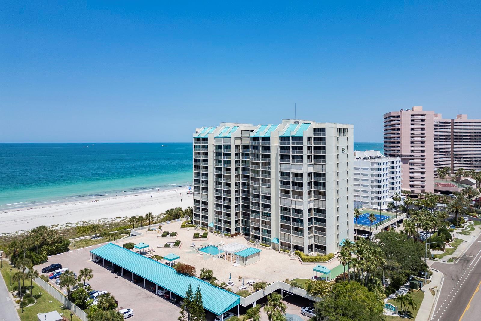 Available immediately for a three + month lease. Imagine waking up to the soothing sounds of the Gulf and Intracoastal waters from your direct beachfront condo at the gorgeous Sand Key Club. This furnished 2 bedroom / 2 bath unit boasts stunning views, a full laundry room, and covered parking for your convenience. With smart TV's, cable, wireless internet, and a private balcony to enjoy breathtaking sunsets, all you need to bring are your personal items to start living the ultimate beach life. Sorry, no pets or smoking. Sand Key Club has resort-like amenities including: direct beach access, beachfront pool, hot-tub / spa, cabanas, shuffleboard, putting green, beachfront barbeque, picnic area, fitness room with a sauna, library with TV and small kitchenette, 24 hour security with secured garage and entry. Convenient location to the Shoppes of Sand Key providing restaurants, shopping and more and across the bridge from the fun activities at #1 voted Clearwater Beach, Tampa &surrounding Central Florida attractions plus quick access to the Tampa airport and St Pete / Clearwater Airport are added benefits to the Florida Beach Life on Sand Key. Helene flooded the fitness room and lobby meeting room and restrooms. They are in the process of rebuilding. Pool and spa deck have renovation plans, so please contact agent for details.
