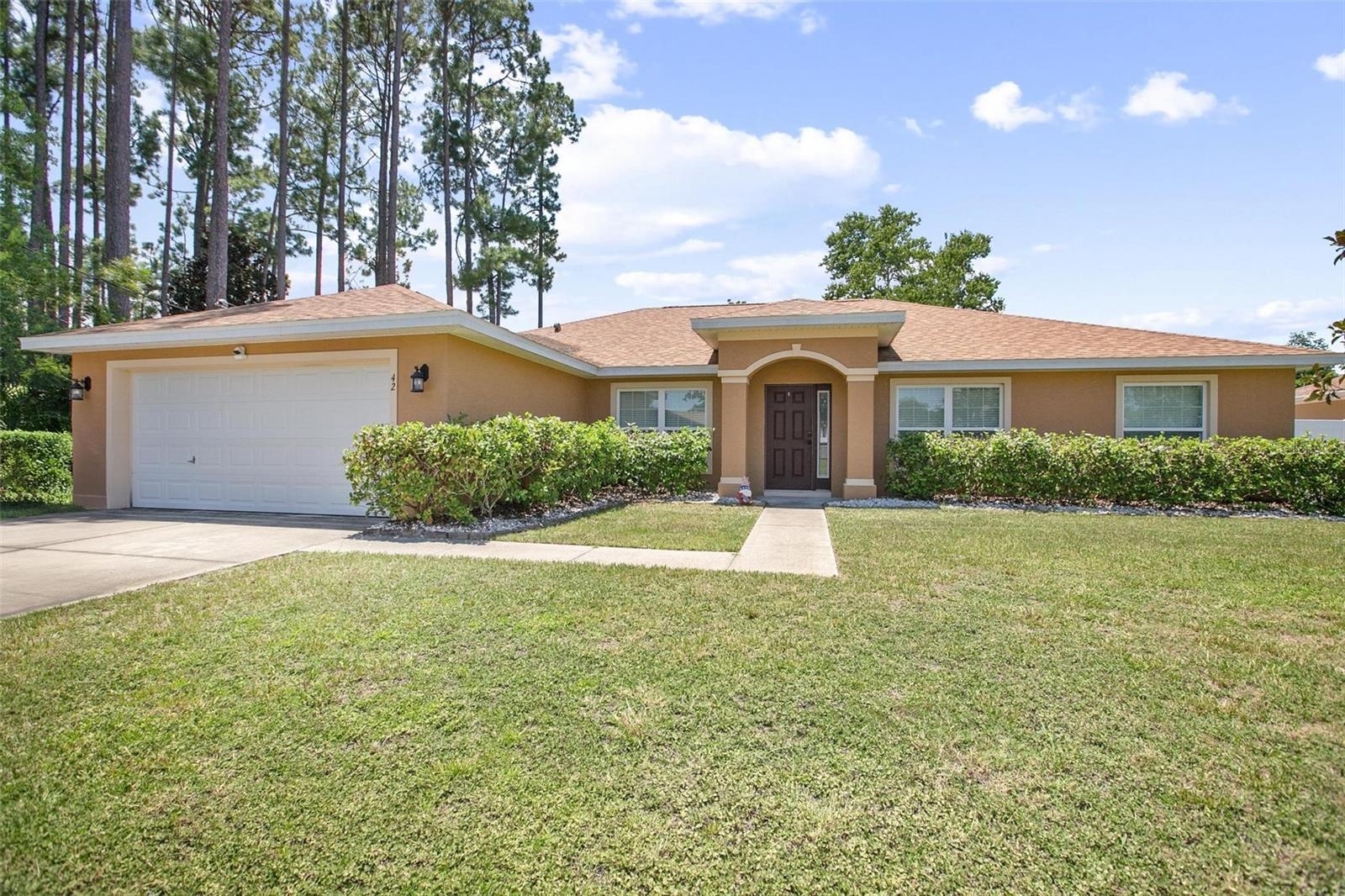 This 4 bedroom, 2 bath Seagate Homes Willow home is located minutes from the beach. Local shopping and restaurants within 2 miles and only minutes from I95. Built in 2017. Roof was replaced in 2022. This home also has many upgrades which include separate dining and cafe space, huge nook with pantry and granite counter tops. The great room is highlighted by vaulted ceilings. The gourmet kitchen features lots of storage with 42" uppers and separate built in cabinets in the cafe with granite countertops. 2 closets in the master. Other upgrades include Ring doorbell, electric keypad on the front door, smart garage door opener with keypad, Nest thermostat, smart light switches in most rooms, window blinds, ceiling fans in all bedrooms, great room, and back porch. All appliances are stainless steel, and the refrigerator has side by side opening French doors. Carpet in the bedrooms replaced 3 years ago with high grade material.
Front load LG washer and dryer included, as well as playset in the 6 ft vinyl enclosed back yard.
