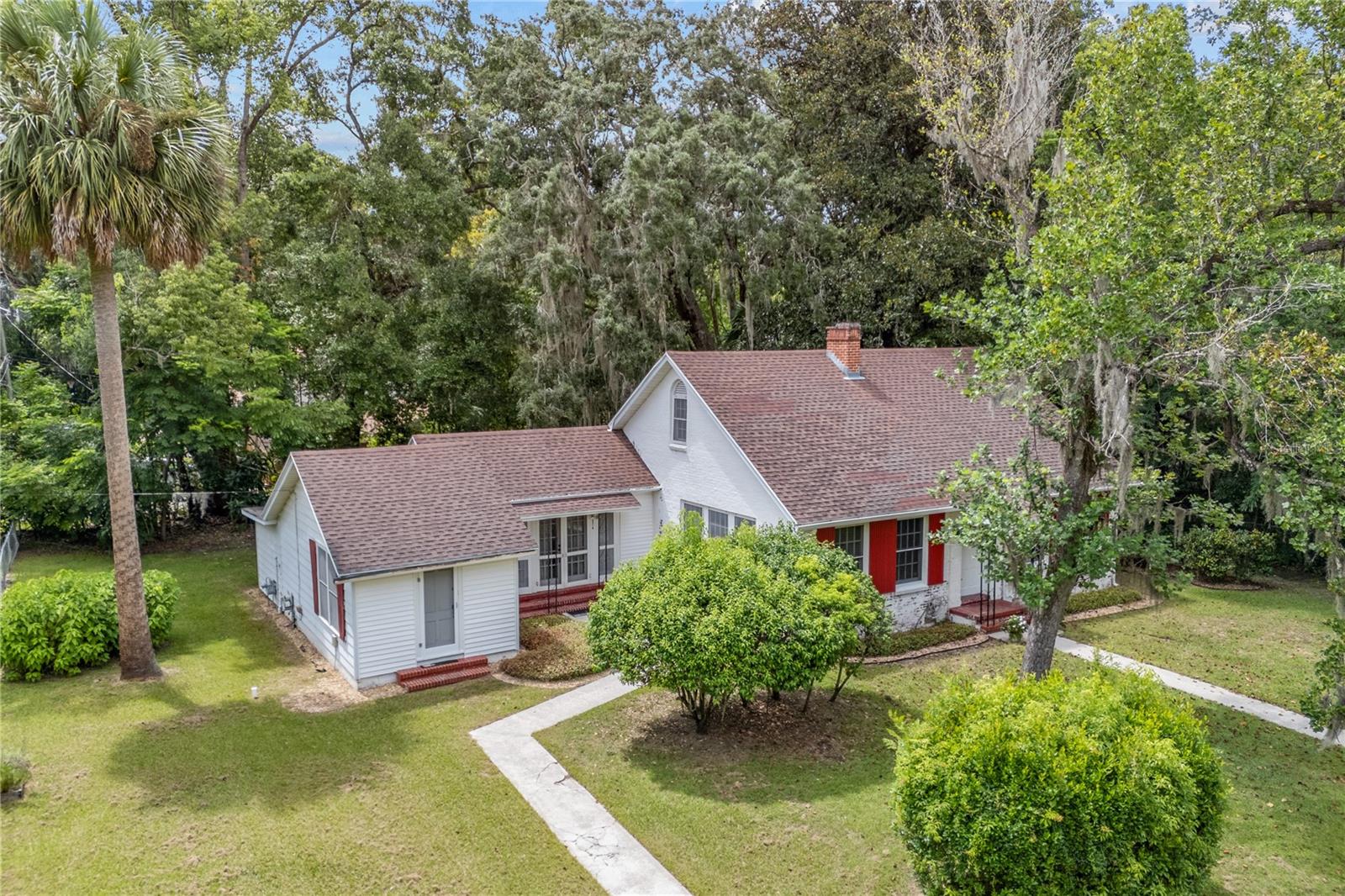 Location, location, location! This charming 3-bedroom, 2-bath, 1657 Sq. Ft. brick home is less than 1 mile from UF stadium and UF campus on a 1/3-acre lot with two complete living areas. One side features 2 bedrooms and 1 bath with bright great room and full kitchen, while the other side includes a bedroom, walk in closet, bath, and kitchenette with its own entrance—perfect for rental income. Nestled on a private street, this corner lot is fenced in and boasts a screened-in rear porch. In a separate storage space at the rear of the house is the washer and dryer. The primary bedroom offers a walk-in closet, and all bedrooms have ample windows, with additional storage closets in the hall. Wood floors, built-ins, and cocoon insulation R30 add extra appeal. Positioned at the center of the lot, there’s plenty of room for expansion and outdoor living. Priced to sell quickly, this home is a fantastic opportunity you won’t want to miss! Go Gators.