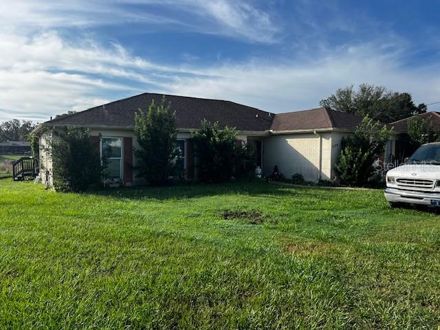 MOTIVATED SELLER - Aggressively Priced for Quick Sale - Needs Cosmetic Clean Up yet has amazing potential as the home offers a caged pool, and is located on Hunter's Lake with great view. Easy access to Suncoast Parkway, Highway 19 to the beaches, restaurants, shopping and medical facilities.