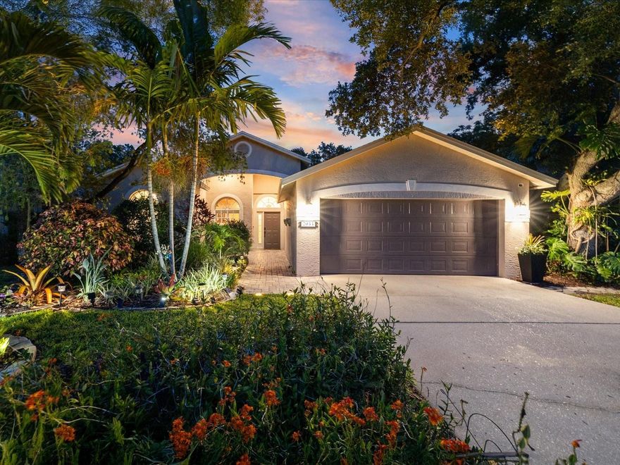 Welcome to your PRIVATE tropical retreat in the highly sought-after Long Branch Creek community. From the moment you arrive, the inviting front porch, paver walkway, Christmas palms, and lush landscaping create a peaceful escape while remaining in central Clearwater. 

Beautifully updated and thoughtfully designed, this 4-bedroom PLUS OFFICE home features an open split floor plan with knockdown ceilings, plantation shutters, natural stone finishes, and seamless indoor-outdoor living spaces ideal for entertaining and everyday living. The home also offers mobility-friendly features including a flush front entry, spacious room flow, open-concept living areas, and an accessible walk-in shower with built-in safety features.           

                                                                                                                                                                                                                                                                                                  The chef’s kitchen showcases granite countertops, travertine flooring, natural stone backsplash, stainless steel appliances, accent shiplap wall, coffee bar with granite top, pull-out pantry storage, spice drawers, and abundant custom cabinetry. The spacious family room centers around an electric fireplace with stone tile surround and custom mantel. The dedicated OFFICE with custom built-ins provides two work-from-home spaces . A mudroom with built-in storage and an inside laundry room with built-in ironing board add everyday convenience.                                                                                                    

The SPA-INSPIRED primary suite serves as a private retreat featuring a spacious walk-in closet, jetted soaking tub, and oversized shower designed for two with dual shower stations, rainfall shower, built-in bench seating, and four invigorating body jets.

Step outside to the RESORT-STYLE backyard where paver and seashell walkways meander through lush tropical gardens filled with bougainvillea, orchids, and thoughtfully designed outdoor spaces. Discover a pergola with a custom gardening table, a fountain surrounded by greenery, seating areas, a firepit gathering space, and a hidden bench swing tucked among the landscape. Towering areca palms and mature landscaping create privacy, enhanced by no neighbor on one side and a horse property to the rear. Beyond the back fence, the property extends to a second fence line, adding extra outdoor space. A discreet enclosed storage area preserves the garden setting while keeping necessities out of sight.

Additional highlights include an OVERSIZED garage with built-in workbench, pool bath, A/C (2022), Roof (2016), Water Heater (2025), low HOA, and extensive upgrades throughout. Ideally located in central Pinellas County just minutes from Tampa, beaches, airports, Costco, Publix, Sprouts, shopping, dining, and everyday conveniences, this home offers an ideal lifestyle of privacy, comfort, and timeless Florida beauty.