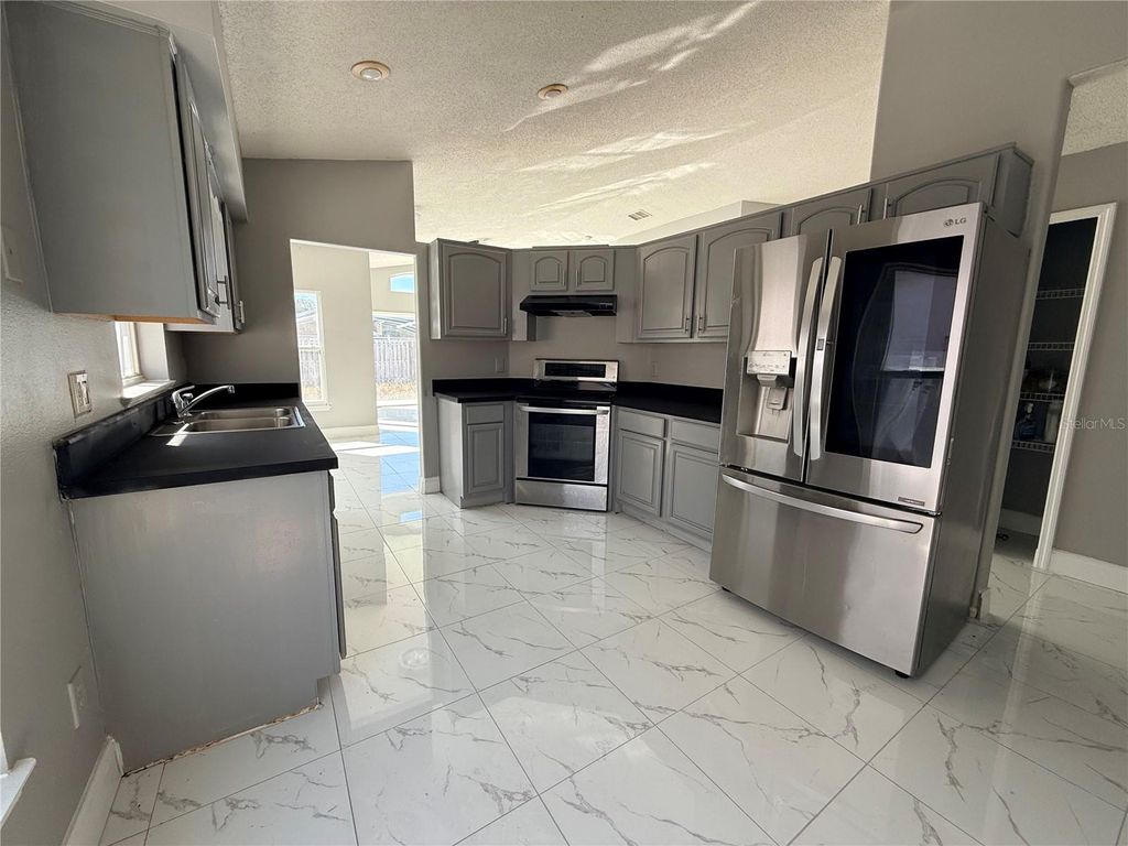 Photo of 1104 Sail Creek Drive, Orlando, FL 32824 (MLS # O6379049)