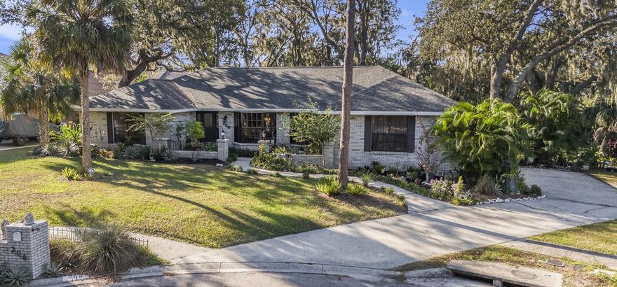 Your serene oasis awaits on over 1/2 acre, tucked away at the end of a peaceful cul-de-sac beneath a majestic tree canopy on one of the most desirable streets in Brandon! This beautifully maintained 4-bedroom, 2-bath pool home blends timeless character with modern comfort and offers a backyard retreat that feels like your own private park. Step inside and you’ll immediately feel the warmth and personality that make this home stand apart. Vaulted ceilings with striking wooden beams, a stone-surround wood-burning fireplace, and expansive bay windows overlooking lush greenery fill the living spaces with light and charm. The open floor plan flows effortlessly from the spacious living room to the dining and kitchen areas, perfect for entertaining or everyday comfort. The kitchen features rich wood cabinetry, vibrant tile accents, and a wide breakfast bar that opens to a sunny eat-in nook with pool and garden views. The split bedroom layout offers privacy for the primary suite, which is separated from the secondary bedrooms. Enjoy peace of mind with recent updates including a NEW ROOF (September 2025), new water heater (2025), new dishwasher, resurfaced & retiled 27,000-gallon, 9-foot-deep pool, and updated bathrooms. French doors lead to your screen-enclosed pool and lanai, surrounded by mature tropical landscaping and the soothing sounds of nature. All of this with an oversized side-load garage, 6-zone irrigation, and no HOA or CDD! Outside, the massive backyard offers endless possibilities — from gatherings and pets at play to gardening or simply relaxing beneath the sprawling oak trees. Conveniently located near US-301, I-75, and the Selmon Expressway, this home combines a serene, tucked-away setting with easy access to shopping, and dining. Located in the sought-after Bloomingdale High School district, this home offers space, privacy, and pride of ownership in a neighborhood that feels like home the moment you arrive. Tampa International Airport is 35 mins away, and it is just over 1-hour from Disney, Universal, Sea World, and the beautiful, award-winning bay-area beaches. If you’ve been searching for a home that feels like Florida living at its best with space, privacy, and undeniable charm, this one could be it!