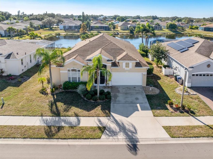Welcome to your own private oasis in the heart of Venice, FL!  This 3 bedroom, 2 bath pool home is located on a serene pond in the highly sought-after Woodmere Lakes community. As you enter the home, you are greeted by an open and spacious floor plan with high ceilings and plenty of natural light. The living room features beautiful views of the pool and pond while the dining room has ample room for all of your dinner parties. The eat in kitchen is a chef's dream with granite countertops, stainless steel appliances, and breakfast bar with an adjacent family room, perfect for entertaining. A separate den with access to the bathroom is the perfect work from home office or could be converted to an additional 4th bedroom. The primary bedroom is a true retreat with a generous walk-in closet and en-suite bathroom complete with dual sinks, a soaking tub, and a separate shower. The split plan features two additional bedrooms which are perfect for guests. The spacious 2 car garage has additional alcove storage and the adjacent interior laundry room has a soaking tub and shelving to help keep things organized. Step outside to your own private paradise! The screened-in lanal (fully replaced in 2024) is the perfect spot to relax and enjoy the peaceful pond views. Take a dip in the sparkling pool (fully refinished 2025) or soak up the sun on the spacious deck. Additional features include a newer roof (2019) HVAC + ductwork (2022) as well as re-piping and storm shutters for peace of mind. Woodmere Lakes is a well maintained community with low HOA fees. Conveniently located near shopping, dining, and just a short drive to the beautiful beaches of Venice. Don't miss your opportunity to own this slice of paradise!