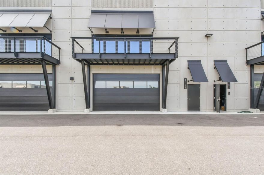 Immerse yourself in the ultimate motorsports lifestyle at the Motor Enclave, the largest private garage community in the world. This 1,435-square-foot private garage offers soaring 25-foot ceilings and a private balcony with direct views of the adrenaline-charged racetrack. With room to accommodate over seven cars and the potential to add a mezzanine to nearly double the square footage, this space is a blank canvas awaiting your vision. Whether you're showcasing your collection, entertaining clients or indulging in high-performance experiences, Garage #1003 is the ultimate car collector's dream garage. Designed for functionality and future buildout, it comes pre-plumbed for water and sewer, allowing for addition of a private bath or kitchen, an individual HVAC unit on the roof, a fire sprinkler system and an insulated overhead door, ensuring every detail meets the highest standards. Ownership here is about more than just the garage, it’s about the experience. On 200 private, gated acres, this motorsports community offers unmatched convenience, experience and prestige, all just minutes from Tampa International Airport, downtown Tampa, Tampa Executive Airport and just over an hour from Orlando. Membership at the Motor Enclave includes access to a 1.72-mile Performance Circuit designed by Hermann Tilke, the globally acclaimed architect behind many of today’s premier Formula 1 tracks, a 100-acre off-road course and a two-acre skid pad for dynamic vehicle testing and adrenaline-fueled fun, as well as a 37,000-square-foot clubhouse offering a variety of social, corporate and leisure amenities. The resort-style pool and lounge area are ideal for entertaining guests while you take to the track. More than just a garage, this is your gateway to an automotive lifestyle, with optional membership to the Enclave Motorsports Club providing weekly track access, exclusive VIP events, and a community of like-minded enthusiasts. Schedule your private tour today and experience firsthand why the Motor Enclave is the premier private garage community.
