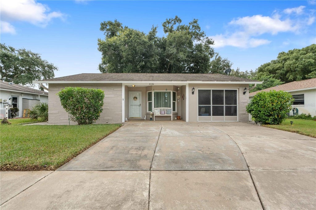 Photo of 8030 Gleneagle Drive, Port Richey, FL 34668 (MLS # W7890036)