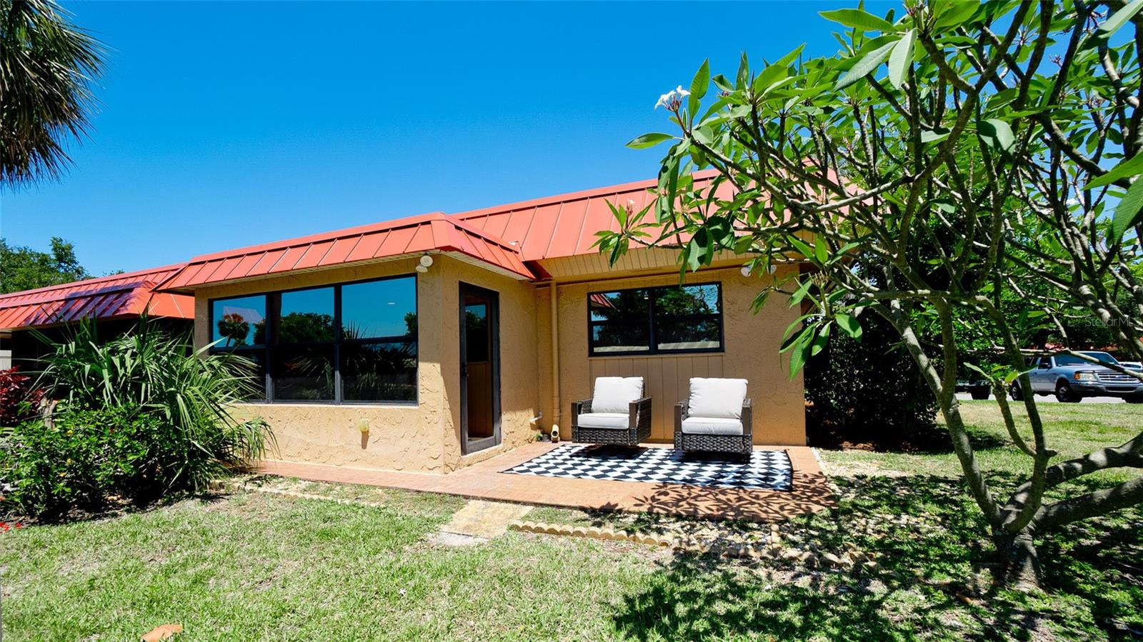 ~Ready to Rent for 6months or up to a year - WATERFRONT LIVING~ Untouched by Hurricane Helene & Milton! You're invited to discover this beautifully renovated unfurnished two-bedroom, two-bathroom waterfront condo that is high enough to stay dry during Helene! Nestled on a canal, this end unit boasts a customizable boat dock, perfect for embracing waterfront living. Step inside to experience a complete renovation with all work completed by licensed contractor, featuring all new electric, new plumbing, and duct work. The open floor plan has been modified and now seamlessly connects the new kitchen, adorned with quartz countertops and new appliances, to the living room and Florida room, offering stunning water views. Enjoy the warm beachy ambiance created by newly installed wood-like tile flooring and ample recessed lighting throughout. The living quarters are thoughtfully separated from the main living space, enhanced by a new indoor laundry area - no more outdoor laundry. Indulge in the tropical oasis of the master bedroom's ensuite bathroom, featuring a double vanity, Serena and Lily wallpaper, and exquisite tile work. The spacious closet with built-ins ensures ample storage. The second bedroom and bathroom boast modern upgrades, while the bright Florida room opens to a patio, perfect for savoring waterfront vistas. This condo offers the ultimate in waterfront living. AC is 2021, Roof is covered by the HOA. Enjoy the benefits of a gated community with loads of amenities that include two heated swimming pools, shuffleboard, tennis courts, billiards room, clubhouse, dry saunas, exercise room with lots of equipment and a view of the pool, workshop, putting green, and clubhouse. Close to shopping, restaurants, Cortez Fishing Village, and the pristine beaches of Anna Maria Island. Come see us today!