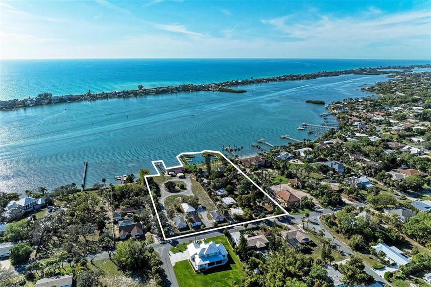 This listing offers one of the last undeveloped intercoastal/bayfront multi-family sites left on the West Coast of Florida which includes a 17-slip marina and additional dockage. This sale includes two separate lots (PID#S-0166150006 & 0166150007), with 3.87 acres combined with 345 +/-ft of Bay-frontage. This unique parcel is zoned for a total of 34 units with preliminary architectural renderings and the Sarasota County DRC pre-submittal application process has been completed along with surveys. With panoramic Bayfront views, large acreage and a private marina, you have the ability to create an exclusive multi-family waterfront development. Additional uses would include a single-family home development, a grand estate property with its own marina and large acreage. Another option would be to reside on one lot and build income producing properties on the other, along with boat-slip rentals. There are 12 buildings on the property with 14 units. Some of the units need work including roofs but are repairable. They are all concrete block except one building. The serene view overlooking Casey Key provides an old Florida feel. This property is ideally located with only 5 minutes to beautiful Nokomis Beach and Jetty, 10 minutes to quaint downtown Venice Island and beach, about 30 minutes from Downtown Sarasota with all of its cultural offerings, restaurants, nightlife, entertainment as well as easy access to the highway within 5 minutes. Take this one-of-a-kind property and transform it into your own Bayfront gem!