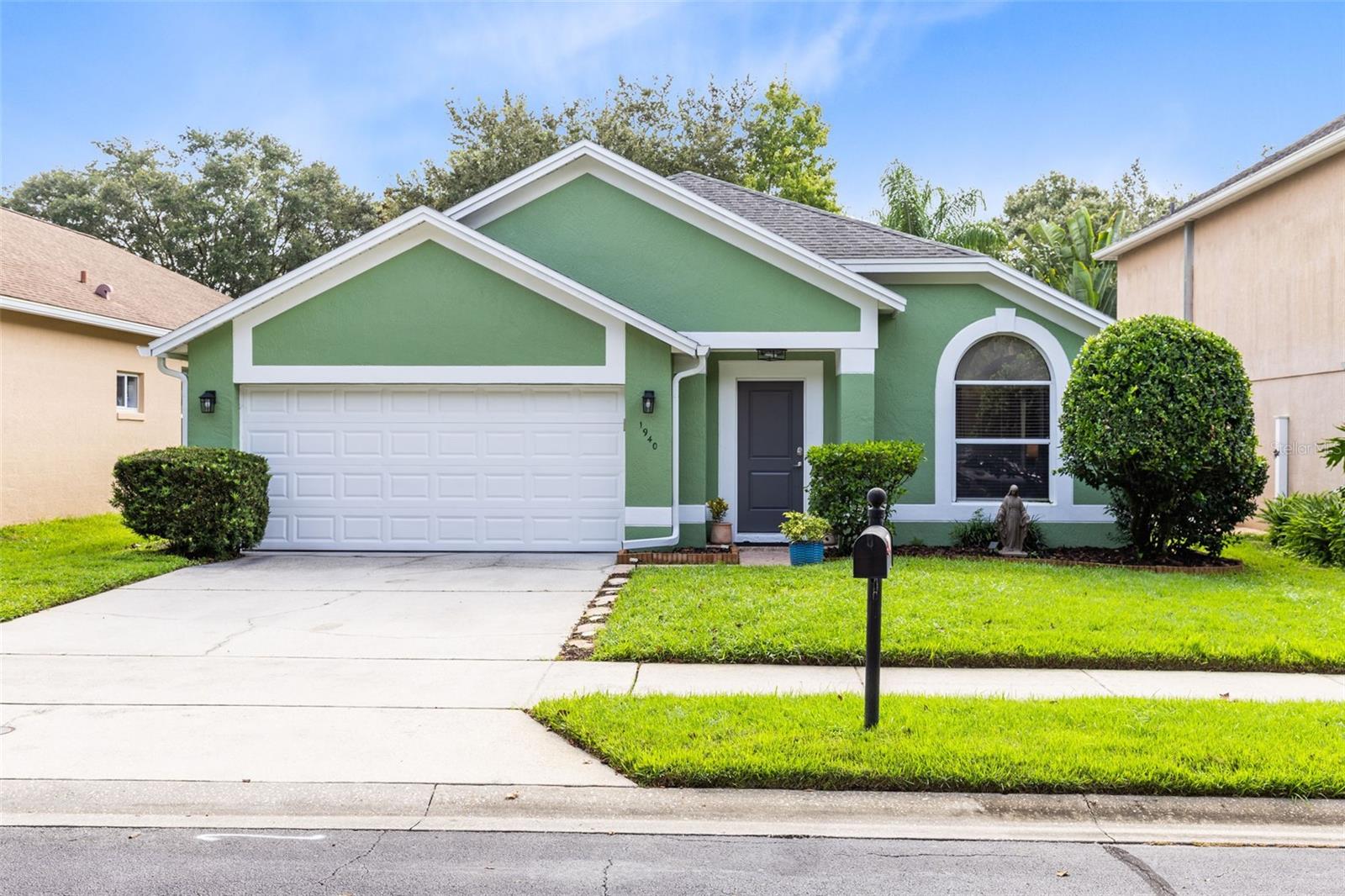 Under contract-accepting backup offers. FULLY UPDATED 3 BEDROOM HOME IN OVIEDO'S GATED EKANA GREEN! *So much NEW - 2025: Water heater, painted garage floor and interior, Sherwin Williams exterior paint, exterior light fixtures 2024: Remodeled primary bath, refrigerator, dishwasher 2021: Whole house repipe, washer, dryer, interior paint, remodeled kitchen, all flooring, oven & microwave!* Tucked behind Ekana Green's gates is 1940 Emerald Green Circle which feels private with no front neighbors or immediate rear neighbors and oozes charm with a lush lawn and mature landscaping, 2 car garage and front door entry with smart lock! Luxury vinyl plank floors invite you in with foyer coat closet along with spacious living and dining rooms showcasing vaulted ceiling, display nook, chic chandelier and arched doorway! Modern updated kitchen boasts shaker style soft close cabinets, Quartz counter, tile backsplash, single basin sink, complete appliance package, closet pantry and sliding glass door with yard views! Kitchen opens to generous family room creating the perfect layout to hang out or entertain! Split floor plan with inviting Primary Retreat has vaulted ceiling, dual windows with lush yard views, display shelf, luxury vinyl floor and updated en-suite bath! Serene primary bath offers adult-height wood vanity with light up mirror, vaulted ceiling, tiled shower stall w/built-in seat, toiletry nook and dual shower heads plus a roomy walk-in closet! Two secondary rooms share modern bath with tub/shower combo, decorative framed mirror and sleek light fixture! Relax out back on your covered screened patio or explore your sizable yard loaded with possibilities and giving the Florida feel with lots of palm trees! Other: Inside laundry room with washer/dryer included, termite bond, 2" blinds on all windows! Ekana Green has tennis and basketball courts which can be easily accessed by a short walk out the back of this home! Fantastic Oviedo location with easy access to Mitchell Hammock Road, the 419, Lockwood Blvd, Oviedo Blvd, 434, steps from a soon-to-be Aldi, Twin Rivers Golf Club, Oviedo on the Park, schools, parks and countless options for dining and shopping! This one is a must see!