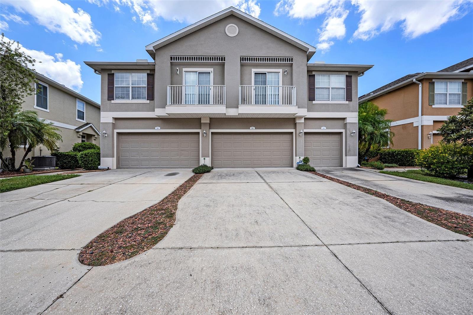 Welcome to this move-in-ready 3-bedroom, 2.5-bath townhome with a spacious 2-car garage, perfectly situated in the sought-after gated community of Little Ridge in New Port Richey. Step inside to an open-concept main level featuring a generous kitchen with ceramic tile flooring, ample cabinet space, a convenient dry bar and a large pantry. The kitchen flows seamlessly into the living and dining areas, creating an ideal space for entertaining or relaxing. All kitchen appliances are new, and the interior of this beauty has been freshly painted. The HVAC system was replaced in 2025. A main-level half bath adds convenience, while the attached 2-car garage offers abundant storage. Upstairs, high ceilings create a bright, inviting atmosphere. The primary suite boasts a large walk-in closet and a private ensuite bath. Two additional bedrooms and a full bathroom provide flexible space for guests, family, or a home office. Residents of Little Ridge enjoy a maintenance-free lifestyle with HOA services covering exterior upkeep, lawn care, water, sewer, trash, and recycling—plus recently replaced roofs throughout the community. The exterior is also scheduled for painting, adding a fresh new look to the neighborhood. This gated community offers peace of mind along with easy access to new shopping, dining, and entertainment options just minutes away. Don’t miss your chance to make this gem your very own—schedule your private showing today!