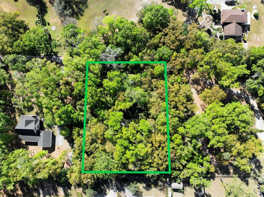 Tucked away beneath a canopy of trees, this one-acre lot offers the perfect blend of privacy, beauty, and possibility. Imagine designing your dream home surrounded by nature, without the rules of an HOA. Wake up to the quiet of the countryside, but still be just minutes from Orlando, the new expressway, and all the attractions.

This property gives you room to breathe—whether you're planning a new home, weekend getaway, or long-term investment. The land is raw, natural, and ready for your vision. Peaceful, yet connected. Secluded, yet accessible.

Rarely do you find land like this: unspoiled, unrestricted, and perfectly positioned.