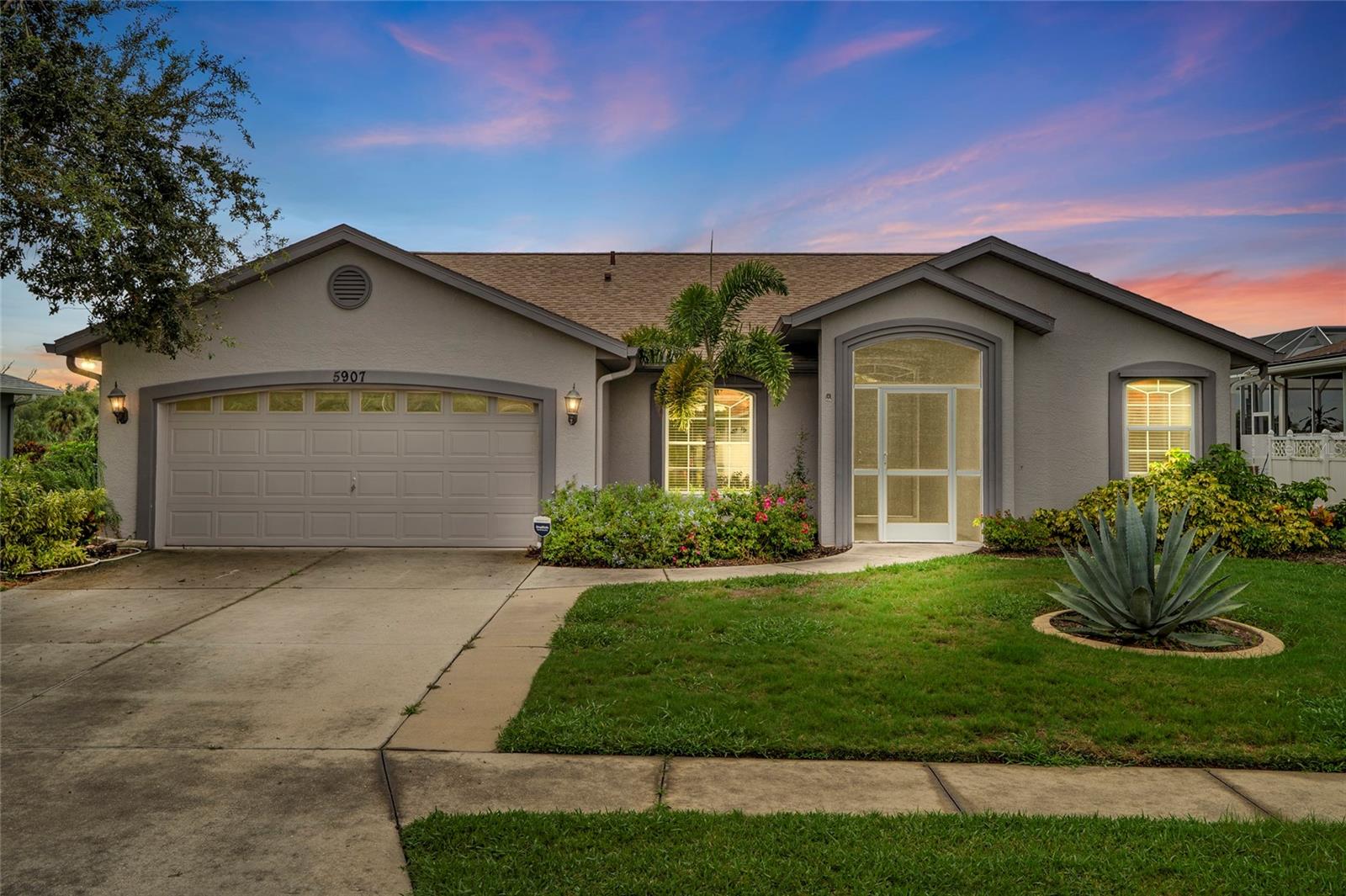One or more photo(s) has been virtually staged. Set on a peaceful lake in the Kew Gardens community, this 3-bedroom, 2-bath home offers the perfect blend of space, storage, and Florida charm. With over 1,800 sq. ft., a new roof (2022), and solid block construction, it’s a home you can move into with confidence.
Inside, every bedroom comes with its own walk-in closet, giving everyone plenty of storage. The split floor plan provides privacy for the primary suite while keeping the main living areas open and inviting. A bright Florida room expands your living space, and the large screened-in patio is perfect for relaxing or entertaining with lake views as your backdrop.
The oversized 2-car garage adds convenience, while the spacious lot gives you room to enjoy the outdoors. Whether it’s hosting a weekend cookout, watching sunsets over the water, or curling up inside, this home is designed to fit your everyday life.
Location, location, location! Families will love the proximity to top-rated schools—Virgil Mills Elementary, Buffalo Creek Middle, and Palmetto High—while commuters will appreciate quick access to I-75 and I-275, making Tampa, St. Pete, and Sarasota all an easy drive.