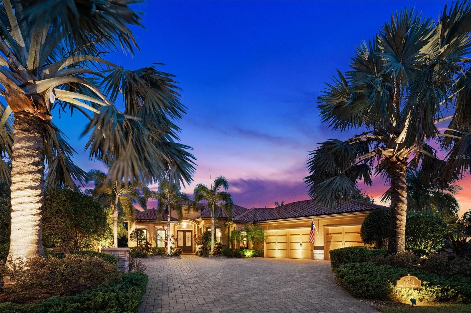 Indulge in the epitome of luxury living with this extraordinary St. James IV Model, meticulously crafted by Paradise Homes, and nestled on an expansive half acre homesite, a rare opportunity in this community, and adorned with lush, mature landscaping. Welcome to the distinguished gated community of Country Club East, located in Lakewood Ranch, the renowned #1 multi-generational master- planned community in the country.
As you enter through the grand double doors, you'll be greeted by a captivating water view and an open great room design. The disappearing sliding doors effortlessly merge the indoors with the outdoors, revealing an exceptional outdoor living area where you will enjoy the convenience of an outdoor kitchen, take a dip in the inviting Pebble Tec pool and spa, gather around the firepit, and relish in ample space for cherished moments with loved ones.
This home was designed with custom architectural details, including elegant wood flooring, extensive crown molding, bespoke light fixtures, a striking gas fireplace with a stone surround, solid wood interior doors, and numerous designer touches throughout.
The chef-style kitchen is a culinary masterpiece, boasting Brookhaven wood cabinetry, exquisite granite countertops, top-of-the-line Viking appliances, an oversized center island with a prep sink, a breakfast bar, and a generously sized walk-in pantry. The Owner's Retreat is a haven of tranquility, featuring oversized walk-in closets with custom cabinetry, a double step tray ceiling, and a cozy sitting area with bay windows. The opulent ensuite offers dual vanities, granite counters, a luxurious garden tub, and an expansive walk-in shower.
In addition to the Owner's Retreat, there are three more well-appointed bedrooms and two and a half baths, as well as a versatile study/den.
This stunning property is constructed with hurricane impact glass windows and doors throughout, ensuring both style and security. Embrace the idyllic Florida lifestyle in this exceptional residence, where every detail has been carefully crafted to offer unparalleled comfort and elegance.