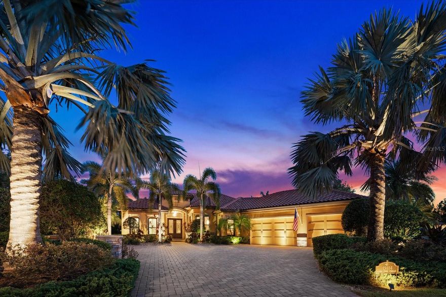 Indulge in the epitome of luxury living with this extraordinary St. James IV Model, meticulously crafted by Paradise Homes, and nestled on an expansive half acre homesite, a rare opportunity in this community, and adorned with lush, mature landscaping. Welcome to the distinguished gated community of Country Club East, located in Lakewood Ranch, the renowned #1 multi-generational master- planned community in the country.
As you enter through the grand double doors, you'll be greeted by a captivating water view and an open great room design. The disappearing sliding doors effortlessly merge the indoors with the outdoors, revealing an exceptional outdoor living area where you will enjoy the convenience of an outdoor kitchen, take a dip in the inviting Pebble Tec pool and spa, gather around the firepit, and relish in ample space for cherished moments with loved ones.
This home was designed with custom architectural details, including elegant wood flooring, extensive crown molding, bespoke light fixtures, a striking gas fireplace with a stone surround, solid wood interior doors, and numerous designer touches throughout.
The chef-style kitchen is a culinary masterpiece, boasting Brookhaven wood cabinetry, exquisite granite countertops, top-of-the-line Viking appliances, an oversized center island with a prep sink, a breakfast bar, and a generously sized walk-in pantry. The Owner's Retreat is a haven of tranquility, featuring oversized walk-in closets with custom cabinetry, a double step tray ceiling, and a cozy sitting area with bay windows. The opulent ensuite offers dual vanities, granite counters, a luxurious garden tub, and an expansive walk-in shower.
In addition to the Owner's Retreat, there are three more well-appointed bedrooms and two and a half baths, as well as a versatile study/den. 
This stunning property is constructed with hurricane impact glass windows and doors throughout, ensuring both style and security. Embrace the idyllic Florida lifestyle in this exceptional residence, where every detail has been carefully crafted to offer unparalleled comfort and elegance.