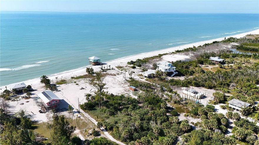 Situated on the north end of Little Gasparilla Island just steps from the Gulf, this property enjoys soft white sand, open Gulf views, and the constant presence of coastal breezes and surf.

Imagine sunrise and sunset walks along uncrowded beaches, shelling, or sight-casting for snook; swimming or snorkeling in the Gulf; or unhurried days spent relaxing on the sand, with immediate beach access just outside your door.

The property includes bay-to-Gulf access and the option to join the Dock 6 association, providing additional boating convenience (membership subject to  association terms).

Little Gasparilla Island is a bridgeless barrier island, accessible only by private boat or water taxi, providing a quieter, more intentional coastal lifestyle. Boating provides access to the Gulf as well as easy day trips throughout Charlotte Harbor, Pine Island, and surrounding waters, with renowned inshore and offshore fishing opportunities. Financing may be available; terms subject to approval.
