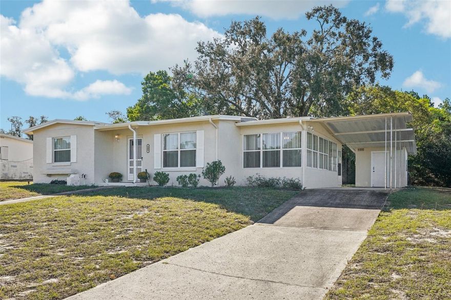 This charming move-in–ready home sits on a spacious .20-acre lot in an established, centrally located neighborhood close to shopping, restaurants, medical facilities, and schools. With 740 sq. ft. of living area and 1,634 sq. ft. under roof, this 2-bedroom, 2-bath residence offers thoughtful updates and surprising space both inside and out. You’ll love the updated kitchen with solid wood cabinets, a generous dining room, and the large enclosed sunroom with air conditioning, perfect for year-round enjoyment. Built-in cabinetry in the sunroom provides convenient storage, and the home also features an interior laundry room plus two outdoor storage sheds. This home sits high and dry on a hill with no flooding issues and includes updated windows for peace of mind. The exterior was recently painted, giving the property a fresh and well-cared-for appearance. The well is available for irrigation only (not warranted), and the home is on public water and sewer. Whether you’re a first-time homebuyer, investor, or seasonal resident, this is an excellent opportunity to own for less than the cost of rent!