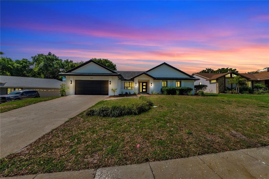 Welcome to 3262 Westcott Court, a fully renovated 4 bedroom, 3 bath residence located in the coveted community of Cobbs Landing in Palm Harbor. Positioned on a quarter acre homesite and offering 2,696 square feet of thoughtfully designed living space, this home delivers timeless style, elevated finishes, and true move in ready convenience.A striking modern front entry opens to soaring vaulted ceilings, wide plank engineered hardwood flooring, and a dramatic floor to ceiling black brick fireplace that anchors the main living area with architectural presence. Natural light fills the interior, enhanced by plantation shutters and a seamless open concept layout designed for both everyday living and refined entertainingThe designer kitchen has been completely reimagined with custom two tone cabinetry, quartz countertops, floating shelves, a statement range hood, and all new stainless steel appliances. Each bath has been beautifully updated, while the private primary suite offers a spa inspired retreat featuring a soaking tub, frameless glass rain shower with thermostatic controls, and marble finishes.
Outdoor living is equally impressive with a screened pool retreat featuring refreshed surfaces, new pool equipment, artificial turf, and a dedicated grilling area ideal for year round enjoyment.Additional upgrades include a new AC in 2024, pool bath, and spacious 2 car garage.
Located within one of Palm Harbor’s most sought after neighborhoods, Cobbs Landing is known for its mature tree lined streets, community amenities, and prime location near top rated schools, golf, beaches, dining, and shopping.
A rare opportunity to own a beautifully curated home in one of Palm Harbor’s premier communities.