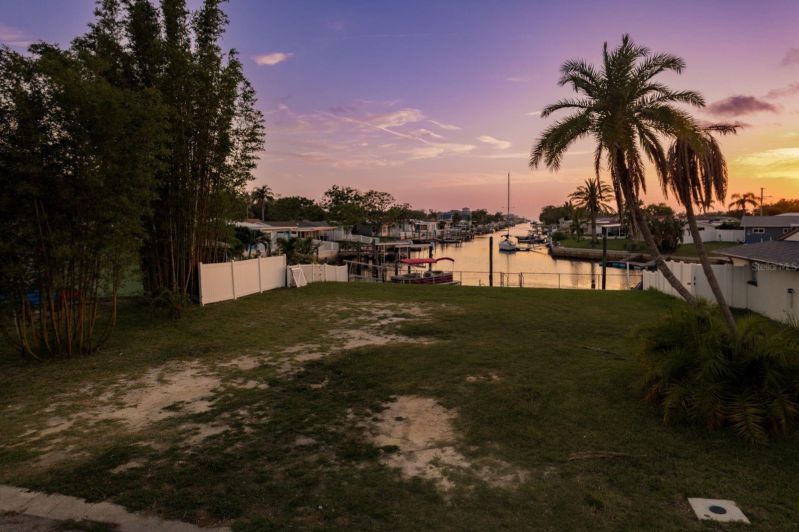PRICE REDUCED! This is the one you’ve been waiting for -- 66 feet of waterfront on a saltwater canal with direct, no-bridge access to the open Gulf. Located on the desirable South Channel in Gulf Harbors, this cleared lot is ready for your custom home or coastal getaway, with public utilities available and a floating dock already in place.
Soil testing and survey have been completed, and impact fees are already paid -- saving you thousands and streamlining your build process. Proposed floor plans are also available, making it even easier to bring your vision to life.
Enjoy wide water views and unforgettable sunsets from your future backyard. Whether you're heading out for a day of fishing, cruising to nearby islands, or simply soaking up the breeze, the Gulf is just minutes from your dock.
This golf cart-friendly community offers an optional HOA and access to the private Gulf Harbors Beach Club for just $200/year -- where you can relax on the sand and enjoy resident-only beachfront living. Publix, restaurants, and local favorites are just a short ride away, adding everyday ease to this extraordinary location.
This lot isn’t just ready -- it’s waiting. With a straight shot to open water, completed prep work, and everything in place to build, this rare opportunity is ready for the home -- and the lifestyle -- you’ve been waiting for.