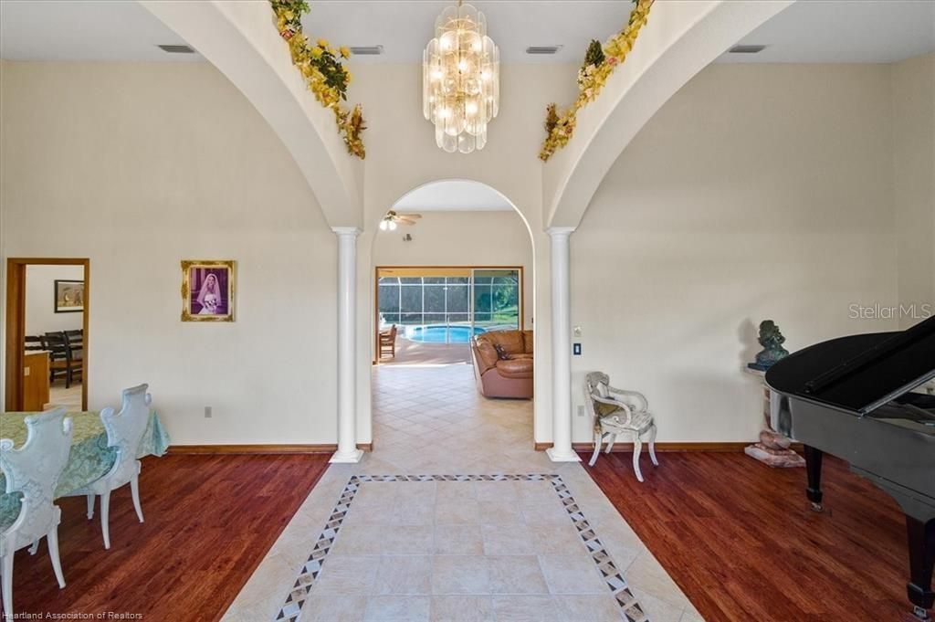 Photo of 631 Sunset Pointe Drive, Lake Placid, FL 33852 (MLS # L4957464)