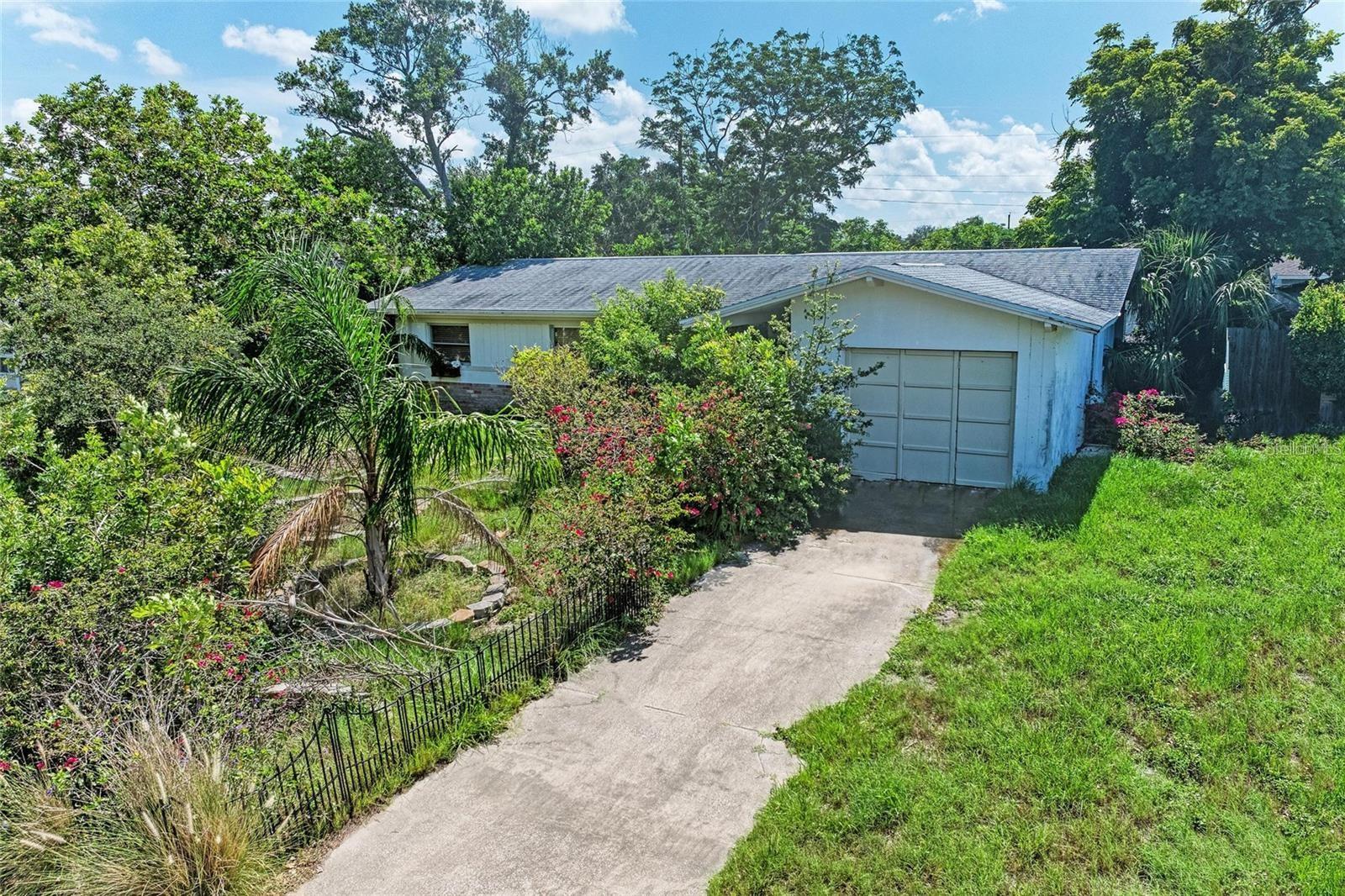 Prime Investment Opportunity in Seminole! Situated on a quiet cul-de-sac in Oakhurst Groves, this 4-bedroom, 2-bathroom home offers a clear path to build equity. The 1,198 sq ft split-plan layout provides a highly functional space, including a living room, dining area, kitchen, and a bonus Florida room. The entire home features durable tile flooring, and a major capital expenditure has already been addressed with a new roof installed in 2015. The property is ready for a straightforward conversion to central A/C, allowing you to add immediate value. With a 1-car garage and the security of a non-flood zone location, this home represents a solid investment. For the buyer ready to apply cosmetic updates, this is an unmatched chance to enter a premier neighborhood. See the outstanding potential and solid value for yourself!