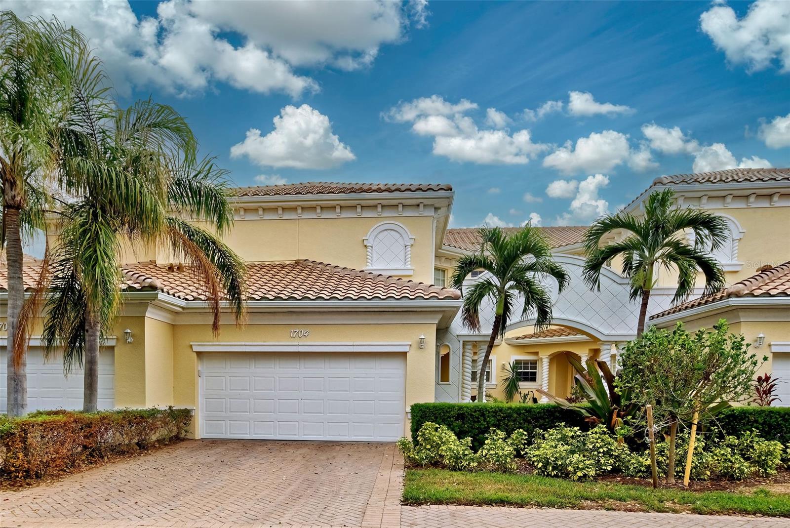 REDUCED!! Welcome to TRIANO, an elegant Mediterranean-designed gated community located just a few minutes from the Island of Venice and the pristine shores of the Gulf of Mexico. Through columned stone arches reminiscent of Italian architecture, an enchanting brick paver courtyard leads you to the front door of a lovely 3 bedroom, 2 bath, first floor end unit. Soaring 10’ high ceilings frame expansive water views as you enter the foyer and living room. A neutral color palette greets you as you enter the open concept living area and spacious kitchen. The kitchen has loads of cabinets, granite countertops, contemporary lighting, and a closet pantry, offering tons of storage and lots of room to entertain. The primary bedroom features two separate closets and an en suite bathroom. The bathroom features dual sinks, a soaking tub and walk-in shower. The two guest bedrooms and guest bathroom are at the other end of the condo offering privacy for you and your guests. A two-car garage completes the picture. Recent UPDATES to the condo include: NEW ROOF, GUTTERS & EXTERIOR PAINT in 2024 and new CARPET in July 2024; new in March of 2021: Refrigerator, Dishwasher, Washer and Dryer, A/C System, hot water heater, and window coverings. The popular community of TRIANO is maintenance-free, has low HOA’s, no CDD fee and is surrounded by several different golf courses. Triano’s resort style amenities include a clubhouse with kitchen and social room, a fitness center and a gorgeous heated pool surrounded by relaxing waterfalls and tropical foliage. Unit 1704 is situated near the pool, clubhouse and fitness center... a great location for an active lifestyle. Just minutes away from pristine beaches, restaurants, shopping, and the charming Island of Venice so rich in history. The new Sarasota Memorial Hospital is less than two miles away, and vibrant Downtown Wellen Park which offers great restaurants, a farmer’s market, live entertainment and winter home of the Atlanta Braves is just a short drive away. Call today to schedule your personal showing… you’ll never want to leave!