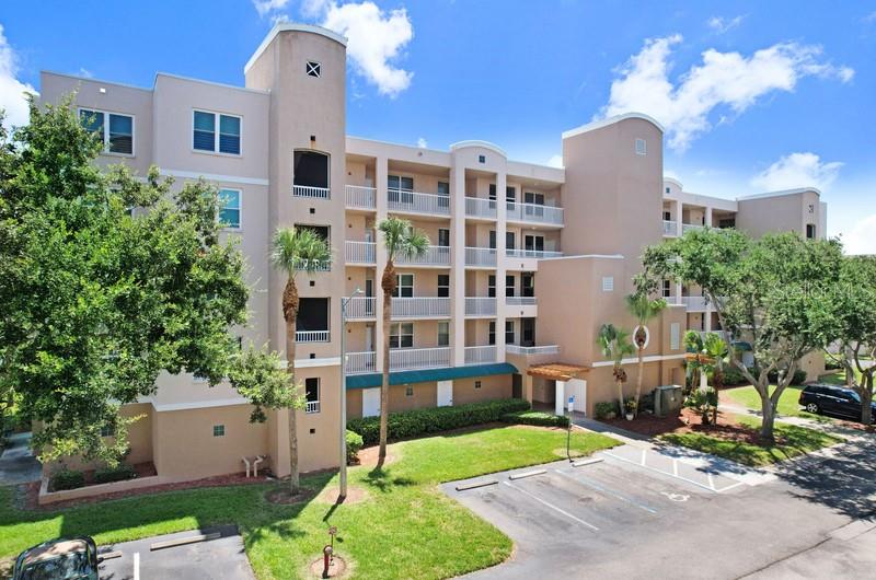 This beautifully turnkey 2-bedroom, 2-bath condo with GARAGE on an elevated level of the desirable gated community of the Shores of Long Bayou. High and DRY from 2024 hurricanes. Offering breathtaking panoramic water views that stretch for miles, this spacious home is a true Florida retreat. This pristine condo offers an open-concept layout creating a seamless flow. The main living area and primary suite both provide access to a private, screened balcony, as well as a full length balcony where you can relax and take in the stunning bayou and pond views. The kitchen is designed for effortless maneuvering, featuring a generous pantry, and a sun-filled eat-in nook. A convenient breakfast bar opens to the expansive living and dining area, making it perfect for hosting. The primary suite is a light-filled sanctuary with private balcony access, dual walk-in closets, and a large en-suite bath. The bathroom is equipped with double vanities, a private water closet, and a step-in shower. The condo includes a full-sized laundry room with a washer and dryer, an entry-side storage closet, and a private one-car garage. The Shores of Long Bayou is a 77-acre waterfront community filled with natural beauty. Residents enjoy a scenic 1.7-mile walking and biking trail, a sparkling pool, a fitness center, and a clubhouse with internet access. The 24-hour manned security gate provides peace of mind. Located just minutes from Gulf beaches, shopping, dining, and entertainment, this is the perfect opportunity to enjoy a picturesque and secure Florida lifestyle.