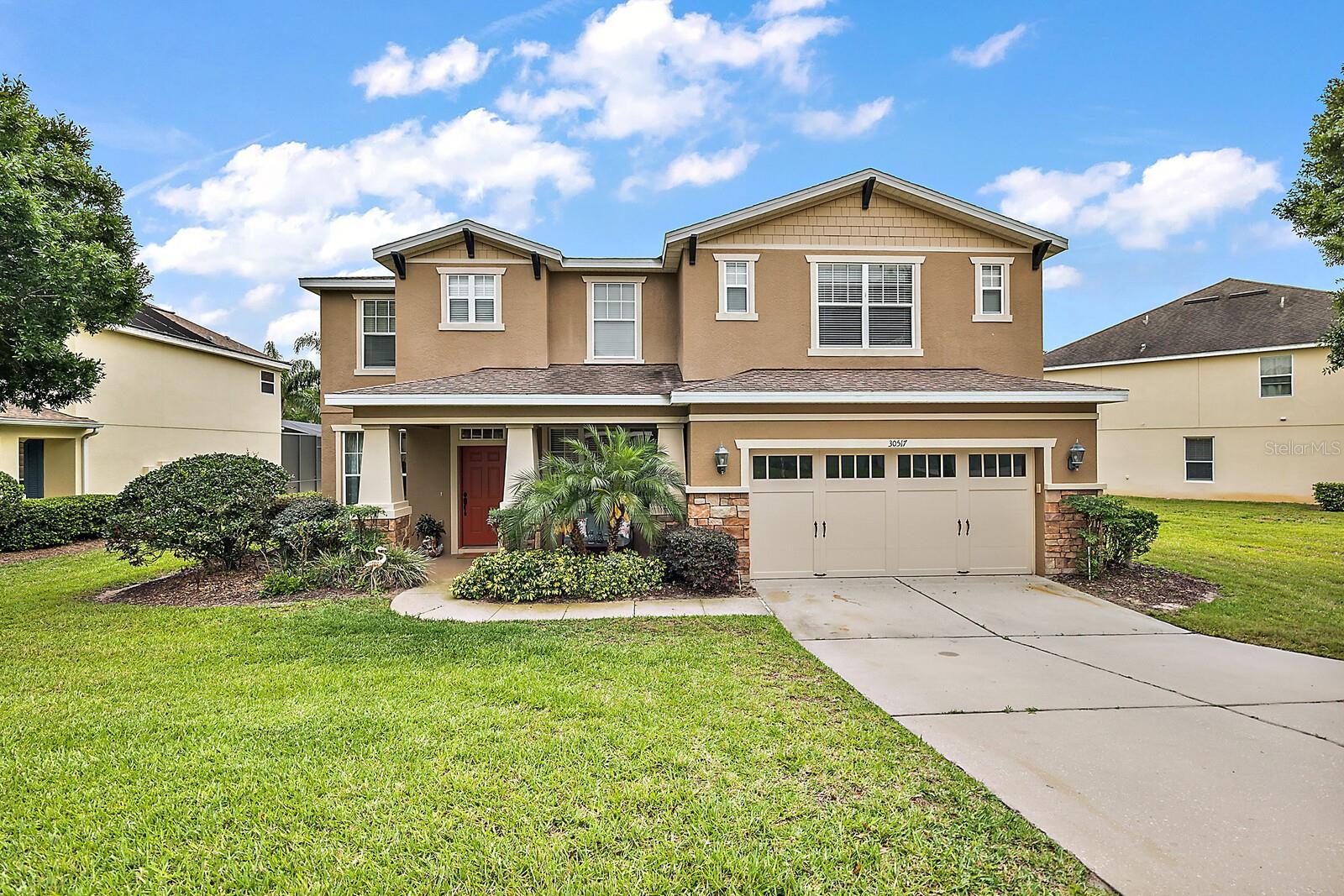 NEW ROOF INSTALLED PRIOR TO CLOSING - BEAUTIFUL MOUNT DORA POOL HOME IN GATED SULLIVAN RANCH. Welcome home to this highly sought-after family-friendly community nestled onto gorgeous acreage graced with a lake, mature trees, and impeccably maintained common landscaped areas. Residents enjoy the magnificent clubhouse, fitness center, Junior Olympic swimming pool, kiddie splash pad park, and endless walking trails. Arrive home and be captivated by the lovely curb appeal. The lush lawn and tidy landscape perfectly frame the home’s stucco façade accented with stacked stone, cedar shakes, a charming gabled roof with corbels, trim-finished windows, a carriage-style garage door, and a welcoming front porch—step inside this inviting interior with stunning wood floors accented with carpet and tile throughout the lower level. Spacious living and dining rooms flank the front entry. Each room is spacious, ideal for entertaining. The family room and kitchen areas are open-concept and ideal for hosting family and friend gatherings. The spacious family room with a ceiling fan and oversized pool-view windows flows seamlessly into the well-appointed kitchen with richly stained wood cabinetry, Corian counters with a tile backsplash, stainless appliances, a center prep island, expansive breakfast bar, and pool view/access dining alcove. Step through the glass slider and enjoy the peaceful lanai and pool area. Adjacent to the kitchen is a convenient half bathroom with a pool door, a laundry room with extra storage space, and a door to the 2-car garage. The wood staircase railing and carpeted stairs lead to the second-floor loft/game room area. The huge owner’s suite has plenty of room for oversized furniture and an office or sitting area. The private en-suite includes two walk-in closets, two sink vanities, a make-up station, a tiled shower, and a garden soaking tub. Bedroom 2 has a walk-in closet and shares a Jack and Jill bathroom with the loft area. Bedrooms 3 and 4 also have walk-in closets and share a full bathroom 3. You will love relaxing or entertaining on the rear-covered lanai within the screen-enclosed swimming pool area. Enjoy no rear neighbors for added peace and tranquility! When you want some fine dining or retail therapy, you are but a short drive from historic downtown Mount Dora with charming shops and bistros, many large retailers and chain restaurants nearby, plus Orlando International Airport, Walt Disney World, and famous beaches, approximately an hour’s drive. What a wonderful home in a perfect location.