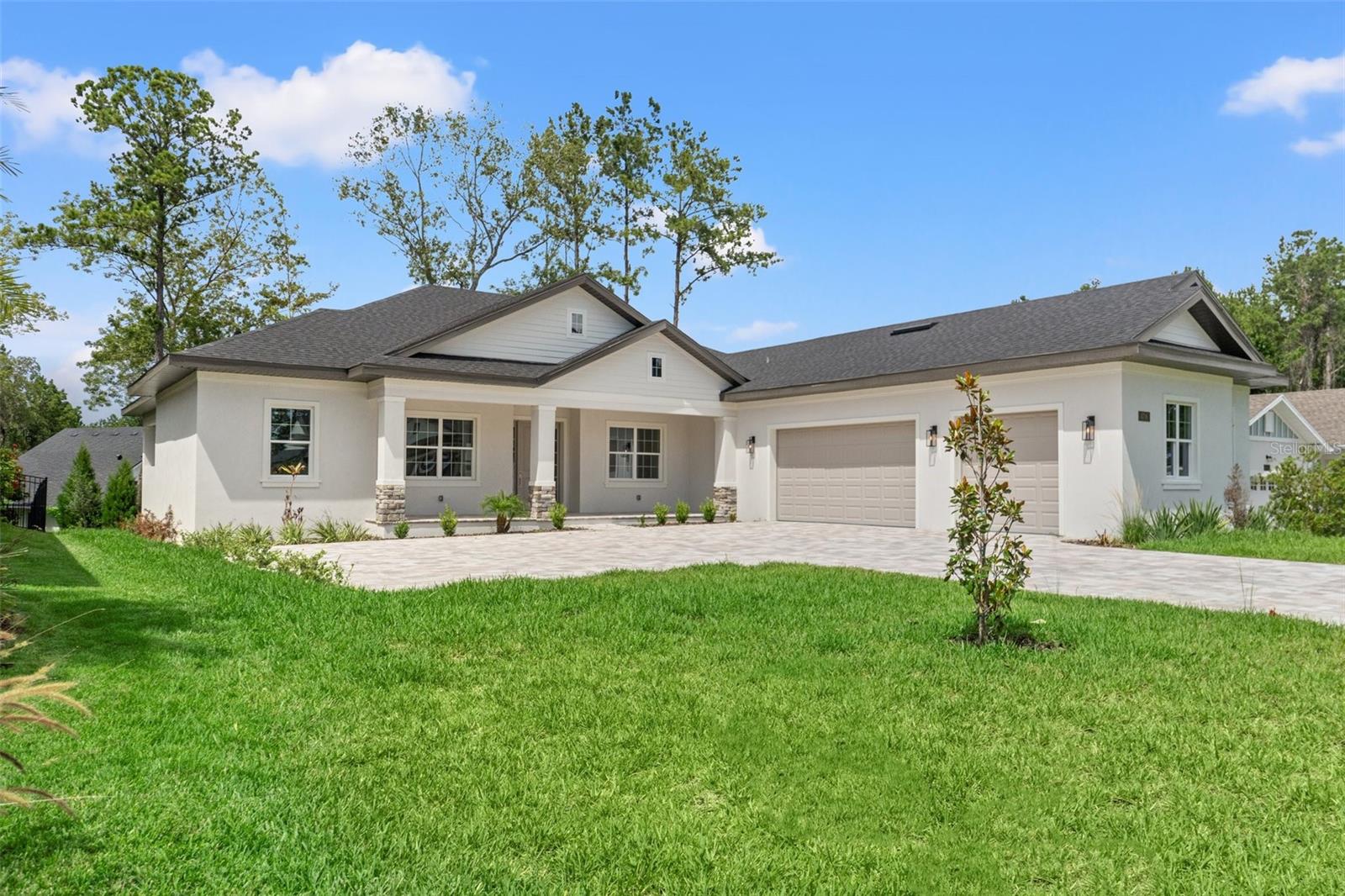 Welcome to this beautiful, brand-new 3-bedroom, 3-bathroom home in the sought-after Southern Hills community, featuring a stunning Pete Dye-designed golf course. This home features a practical split open floorplan, perfect for everyday living and hosting friends. The modern kitchen, with sleek quartz countertops and top-notch appliances, makes cooking and entertaining easy and enjoyable. The master bedroom offers a large walk-in closet, dual sinks, a soaking tub, and a separate shower. Outside, a fully equipped summer kitchen is great for barbecues and outdoor meals. The open living area, filled with natural light and stylish finishes, feels both comfortable and inviting. A spacious laundry room with washer and dryer adds convenience, and the oversized paver driveway and 3-car garage provide plenty of room for parking and storage. Located in an exclusive golf course neighborhood, this home offers a relaxed yet upscale lifestyle. Schedule a tour today!