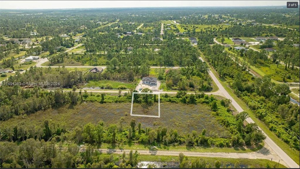 Photo of 853 Belden Avenue, Lehigh Acres, FL 33974 (MLS # O6343632)