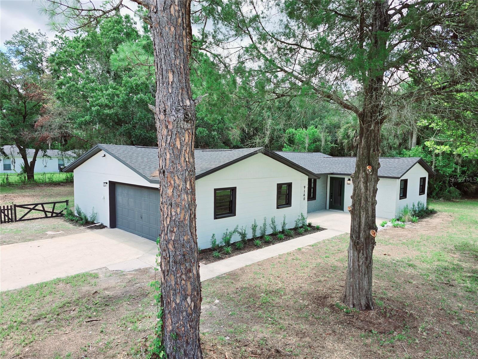 This is your Opportunity! Seller is contributing with Closing Costs. Welcome to this MARVELOUS/STAGGERING completely Modern/Contemporary style Renovated Home!!! Located in the beautiful Crystal River town closed to ocean, centered around its pristine waterway, the Three Sisters Springs for kayaking, fishing, Kings Bay, and is self-proclaimed “Home of the Manatee". Improvements to this property were made with no expense spared, “pushing the boat out”. Spacious modern open floor plan concept, big picture windows, plenty of natural light, corner oversize lot and infused with multiple high-quality upgrades. Astonishing spacious Contemporary Design kitchen with armoire NEW top-quality cabinets, quartz countertop, top of the line new stainless steel smart appliances, splendid backsplash, and a center island for the family to gather around as a breakfast nook. NEW Luxury Vinyl flooring, water resistant and scratch proof throughout the complete house. Gorgeous completely remodeled bathrooms that include new modern vessel sink cabinets, shower tiles, glass door panels, toilets, mirrors, light fixtures, faucets and hardware. NEW roof, A/C, interior doors, exterior door, light fixtures, chandeliers, garage door motor, electric trimming and freshly painted with designer paint color palettes. This beautiful property comes with a staggering landscaping that brings this property to the next level. It is the equivalent of buying a brand-new property, but BETTER, with higher quality finishings. Surrounded by fishing charters, minutes away from the coast, close by boutique shopping areas, restaurants, hospitals and everything you ever dreamed in your Florida home. Most Important, you won't have to worry about flooding concerns, this property is out of the scope. This is your HOME!