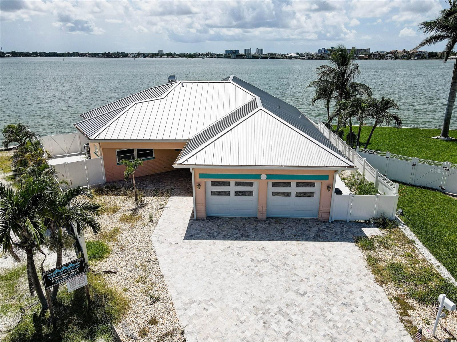 Waterfront Double Lot – 11005 & 11055 8th Street East, Treasure Island
Exceptional opportunity to own two adjacent waterfront parcels with over 200 feet of frontage, perfectly positioned on the point of a peninsula to capture expansive panoramic open-water views in multiple directions. Enjoy direct deep-water access to Boca Ciega Bay and the Gulf, along with breathtaking sunsets from this prime location. Ideal for building a custom luxury estate, developing multiple residences, or creating a standout investment property. Located in a peaceful neighborhood just minutes from white-sand beaches, vibrant dining, and downtown St. Pete, this property delivers unmatched views, premier boating access, and outstanding development potential.
This 3-bedroom, 2-bath home offers timeless charm and waterfront living at its best. Nestled along the Intracoastal Waterway, it blends comfort, simplicity, and scenic beauty in a layout that’s open, airy, and ready for your vision. Terrazzo floors flow throughout, with natural light enhancing every corner of the living, dining, and kitchen spaces.
The primary suite features a walk-in closet and en suite bath, while two additional bedrooms provide room for guests, a home office, or creative space. Outside, a private pool takes center stage—surrounded by lush landscaping and set against 77 feet of waterfront with partial Gulf views and full access to both the bay and the Intracoastal.
Built with solid block construction and topped with a metal roof, this home also includes a two-car garage and sits on a cleared lot nearly 8,000 square feet in size. Public utilities, slab foundation, and no HOA restrictions make it an easy fit for either full-time living or a flexible investment. The home is unfurnished, allowing you to infuse it with your own coastal style.
Whether you're envisioning a serene personal retreat or a bold redevelopment, this property delivers space, location, and boundless potential. Let the water, the light, and the lifestyle welcome you home at 11005 8th Street East.