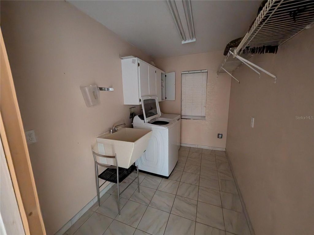 Photo of 110 Peckham Street SW, Port Charlotte, FL 33952 (MLS # O6369175)