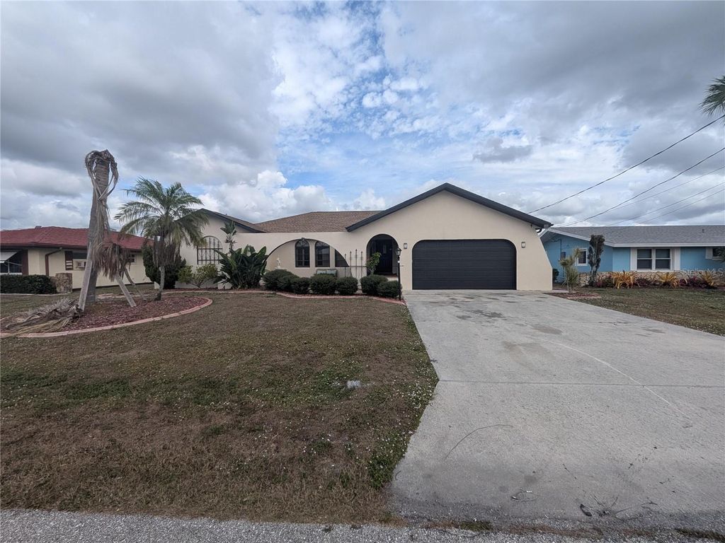 Photo of 110 Peckham Street SW, Port Charlotte, FL 33952 (MLS # O6369175)