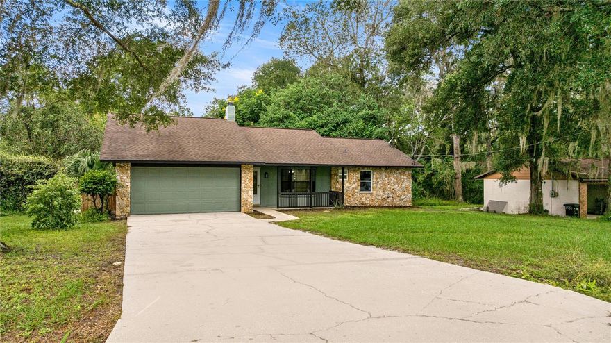 Welcome to this beautifully renovated 3-bedroom, 2-bath block home in the desirable Stone Hill neighborhood. This home features a split floor. The primary bedroom has a walk-in closet. The large kitchen comes with stainless steel appliances (dishwasher and stove are brand new), granite countertops with a breakfast bar, and a large pantry. The living room features high ceilings and a beautiful stone wall with a wood-burning fireplace and a beautiful bay window overlooking the covered front porch. Brand new windows throughout! Brand new sliding door opens to the enclosed back porch. There is a city lot behind the home, so there won't be neighbors in the back of the home. Roof 2019. Minutes away from Pearl Brittan Plaza, which includes a Publix and several restaurants. 2 storage sheds in the backyard are included.